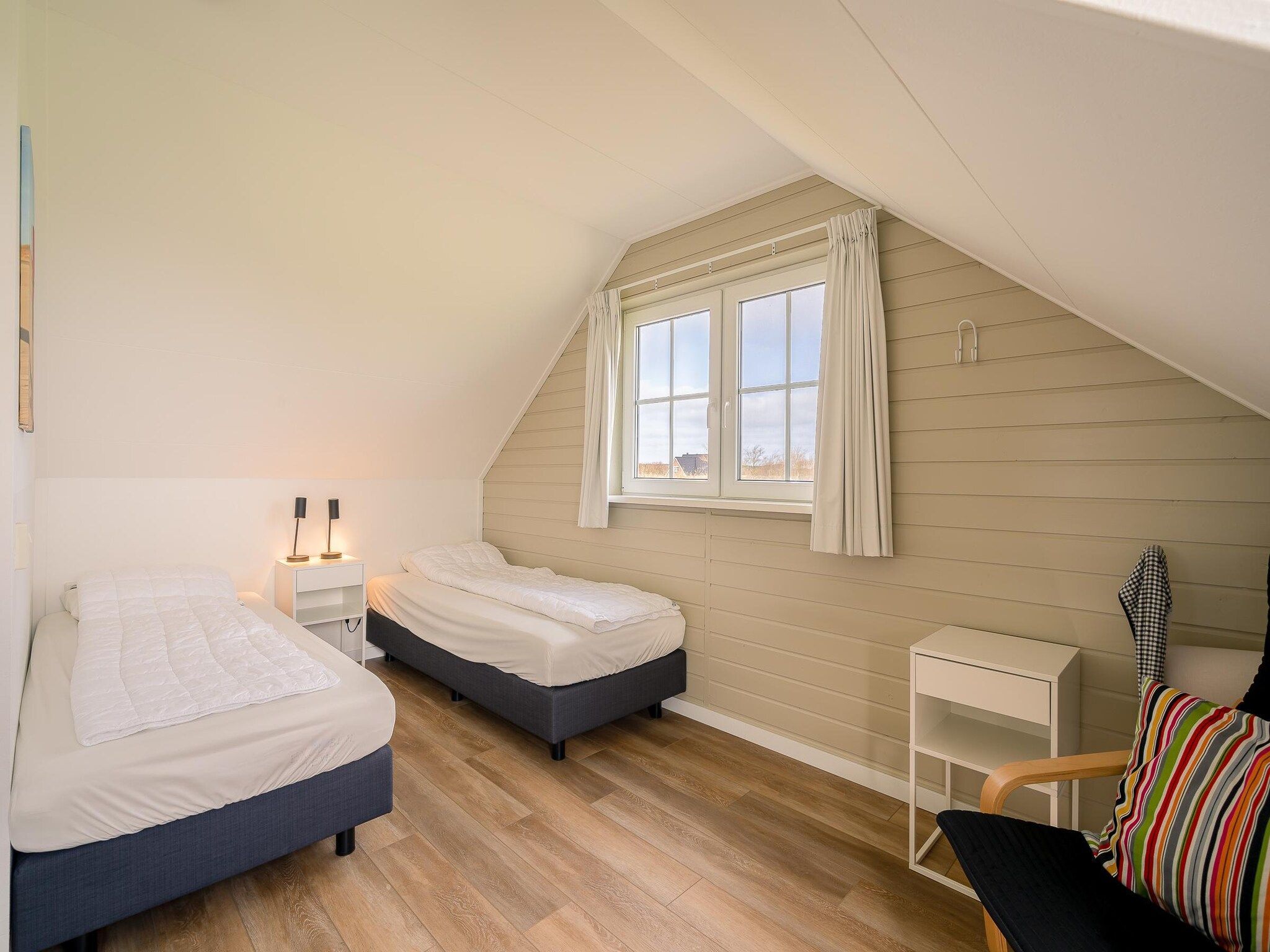 Een slaapkamer van De Annabella 11- De Zandhaas in De Koog