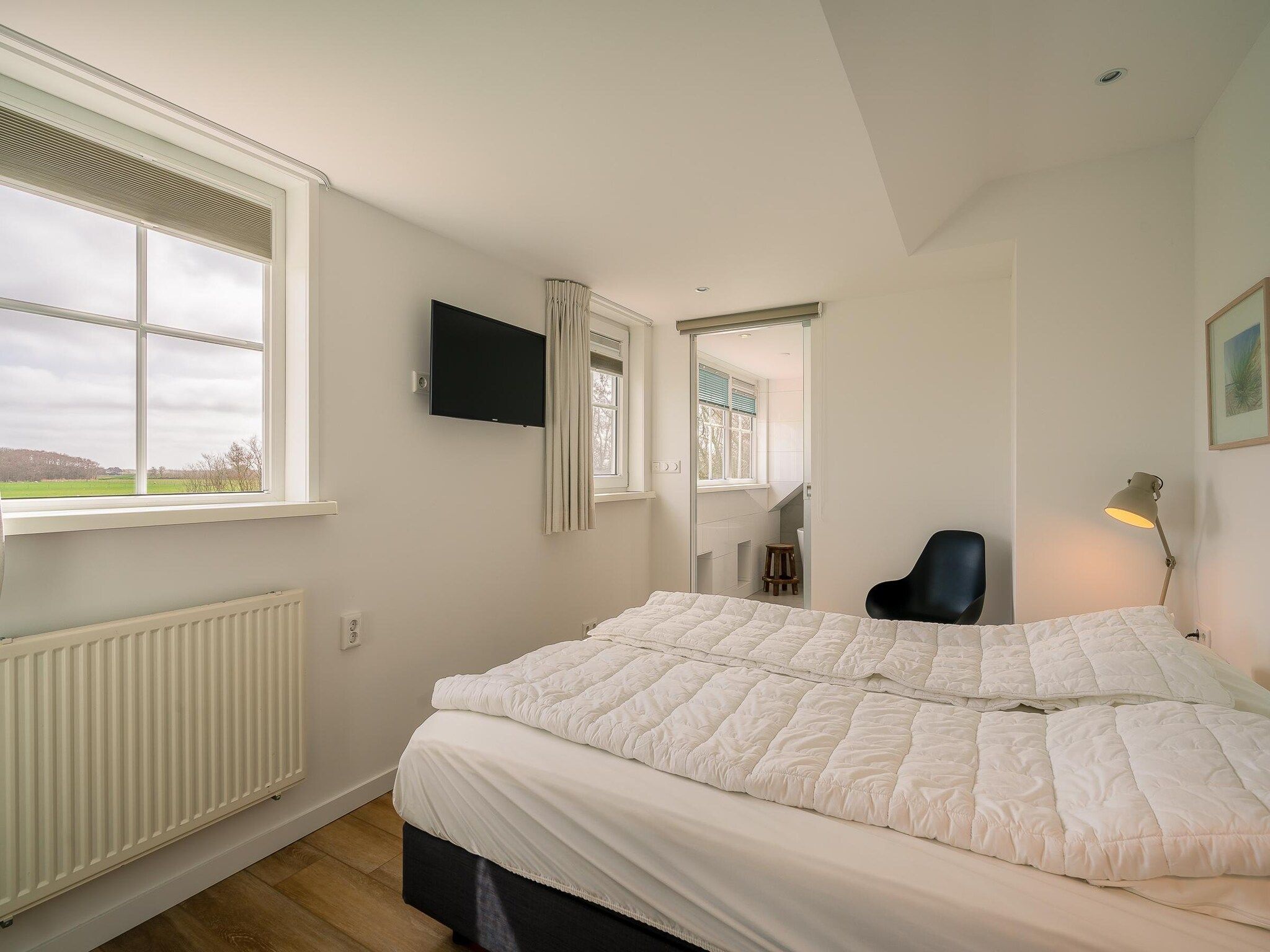 Een slaapkamer van De Annabella 11- De Zandhaas in De Koog