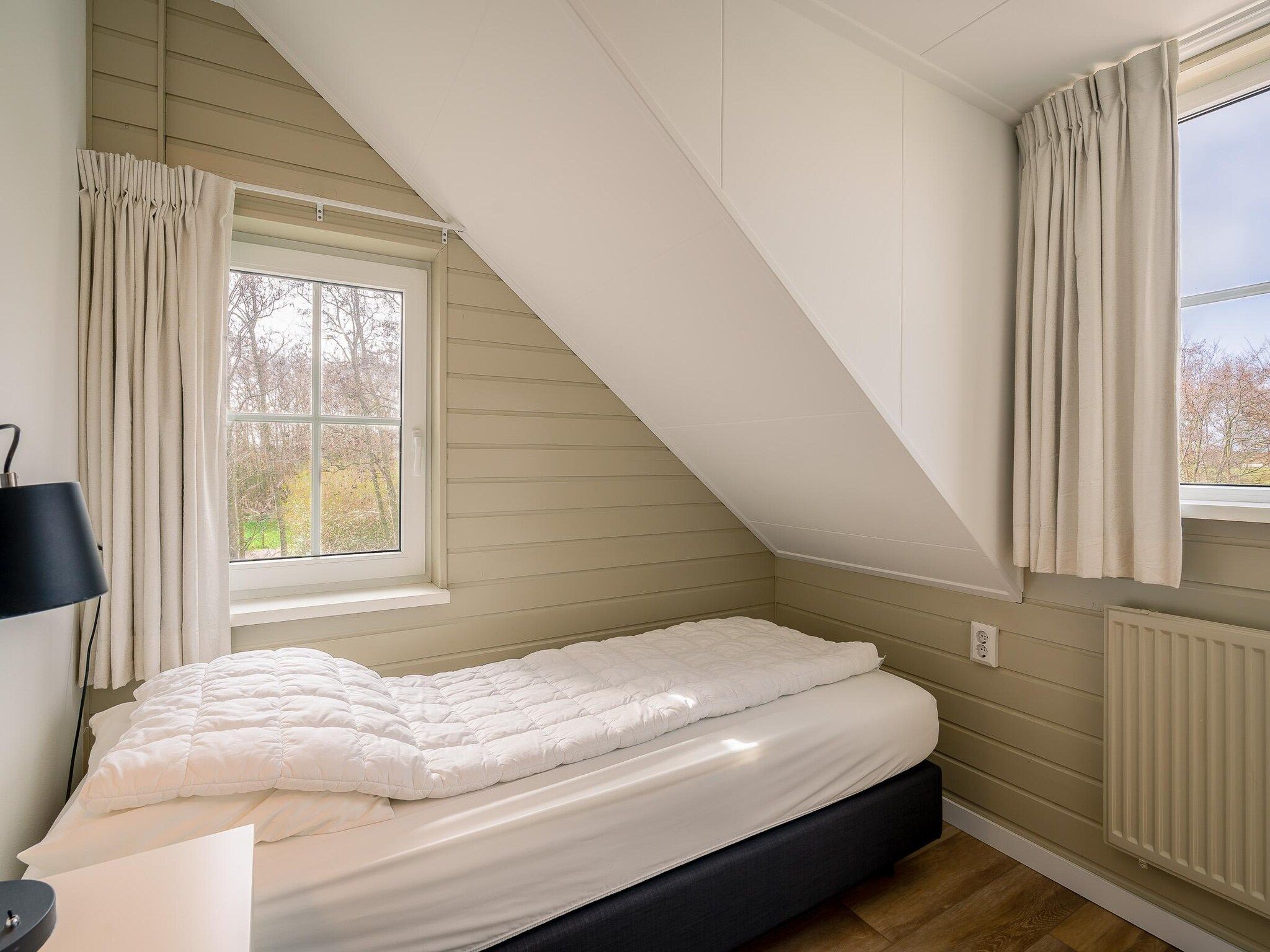 Een slaapkamer van De Annabella 11- De Zandhaas in De Koog