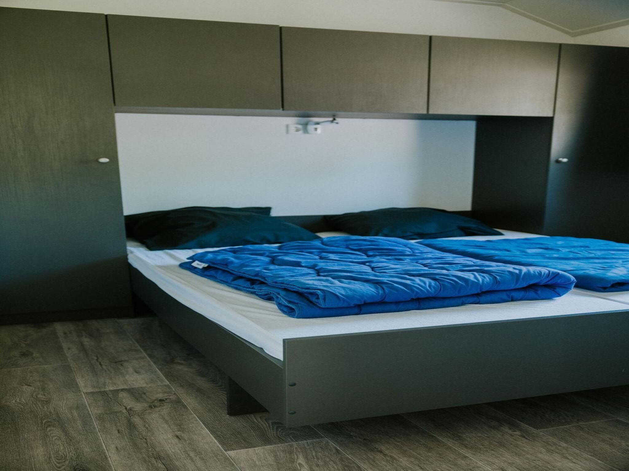 Een slaapkamer van Boslodge l 4 persons in Balkbrug