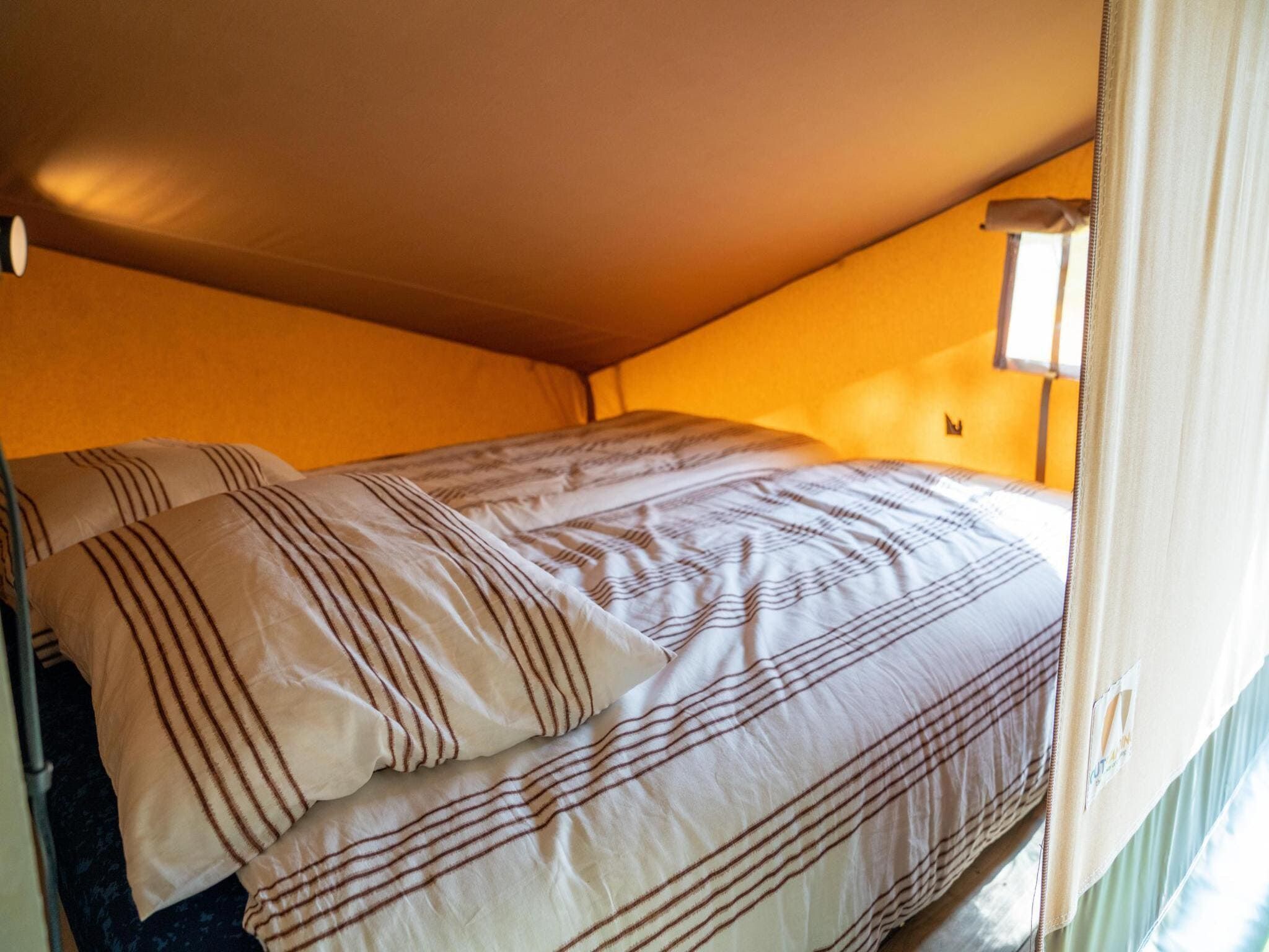 Een slaapkamer van Ranger lodge | 6 persoons in Balkbrug