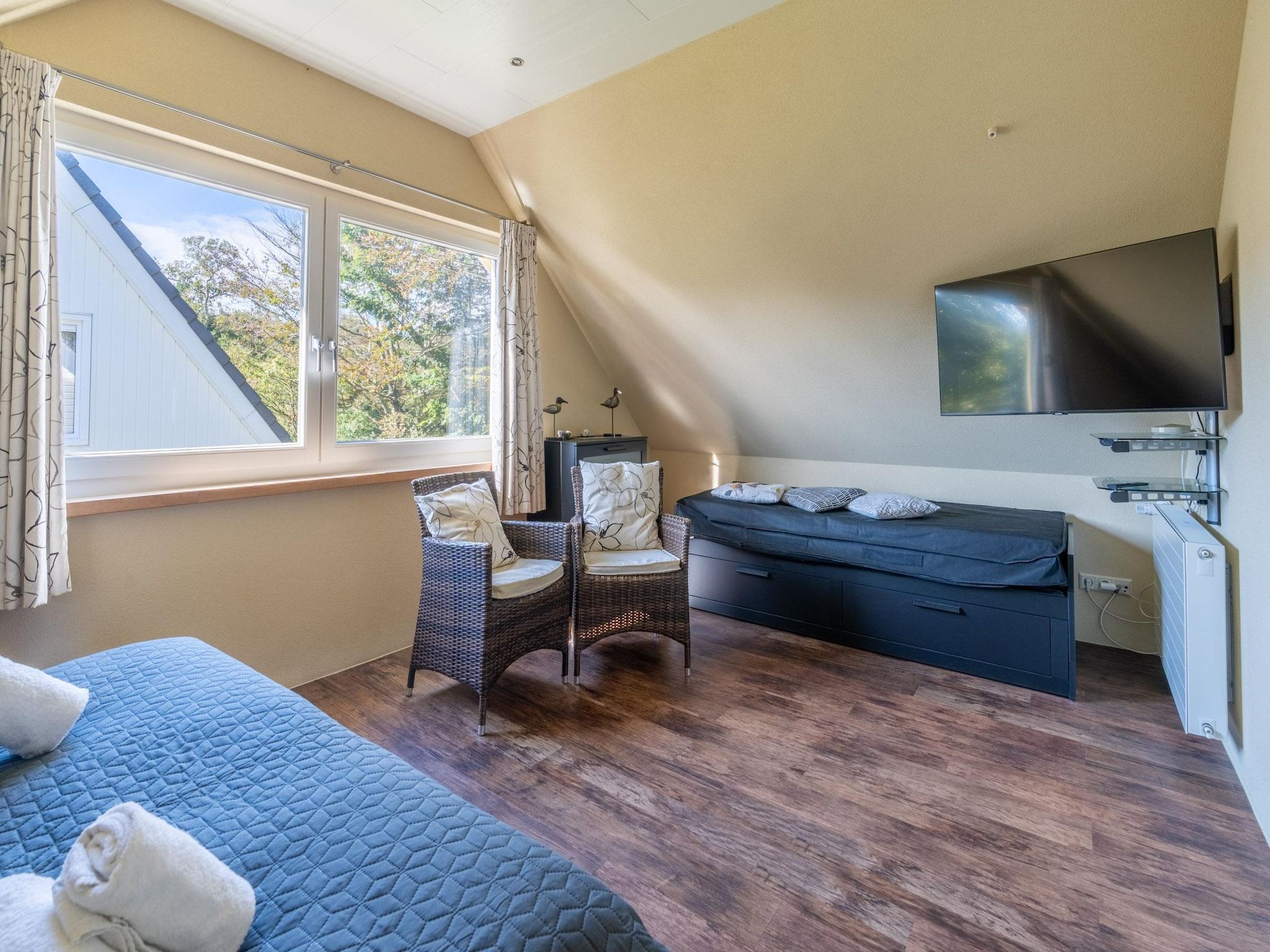 Een slaapkamer van Tempelierweg 22 in Den Burg