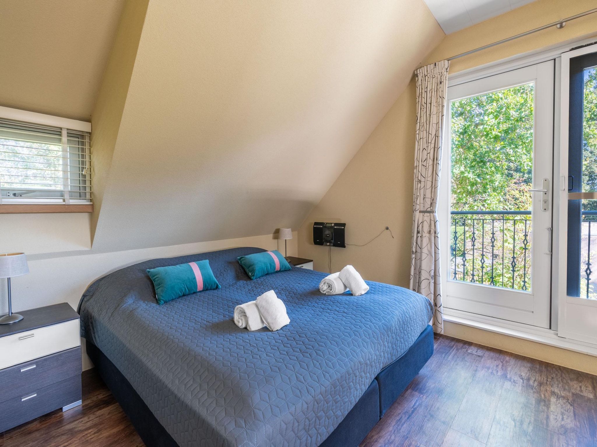 Een slaapkamer van Tempelierweg 22 in Den Burg