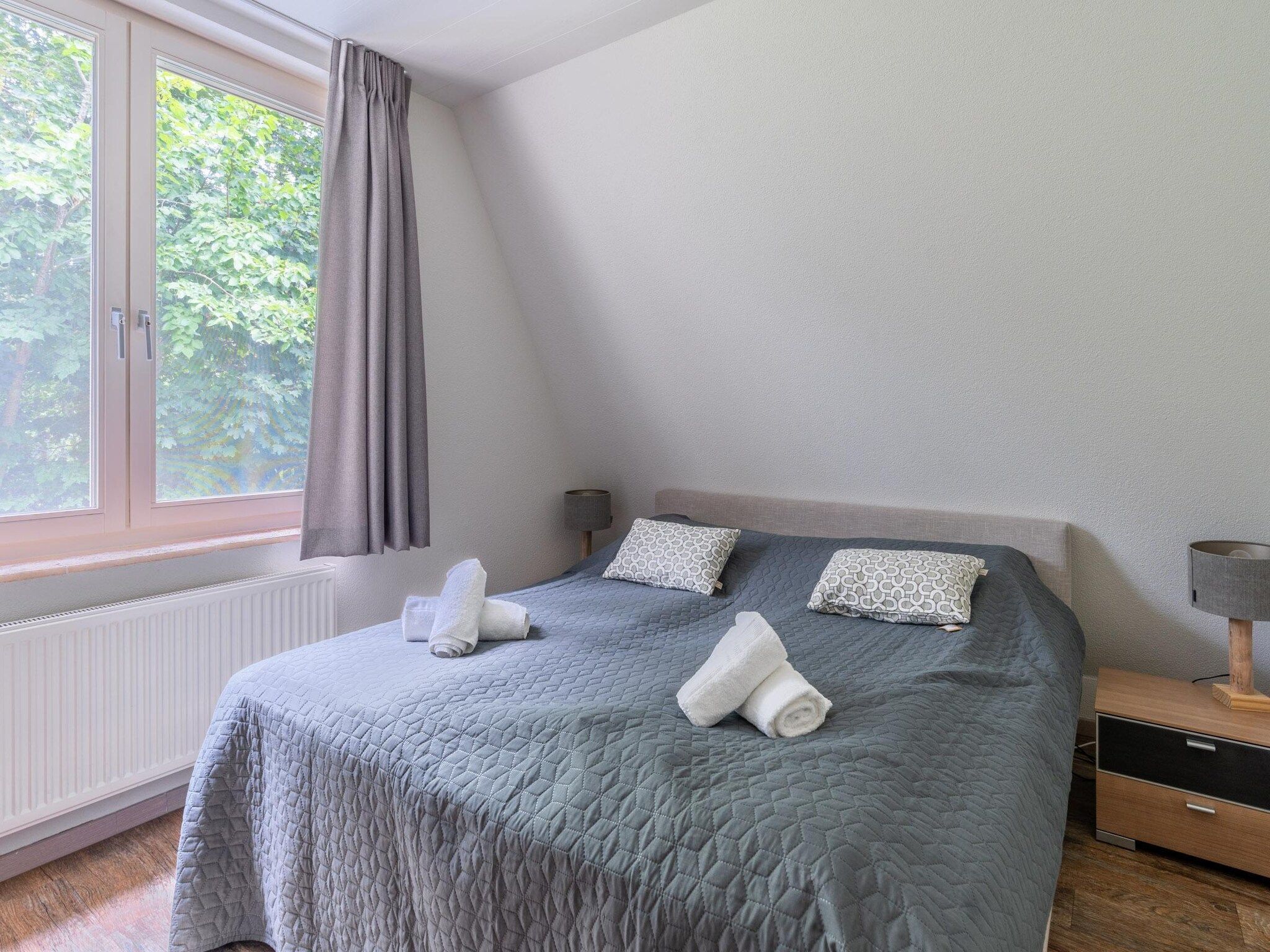 Een slaapkamer van Eb & Vloed in De Koog