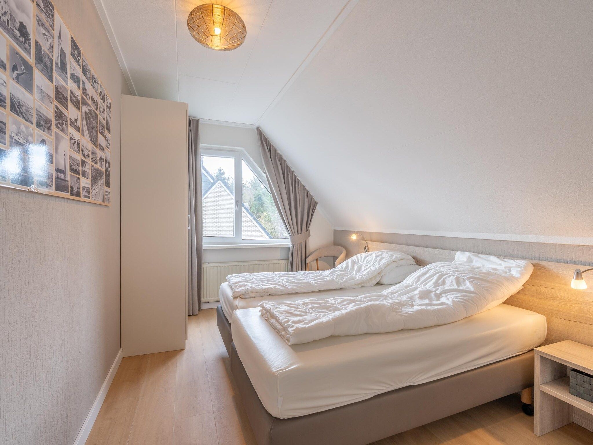 Een slaapkamer van Kamperfoelie 77 in De Koog