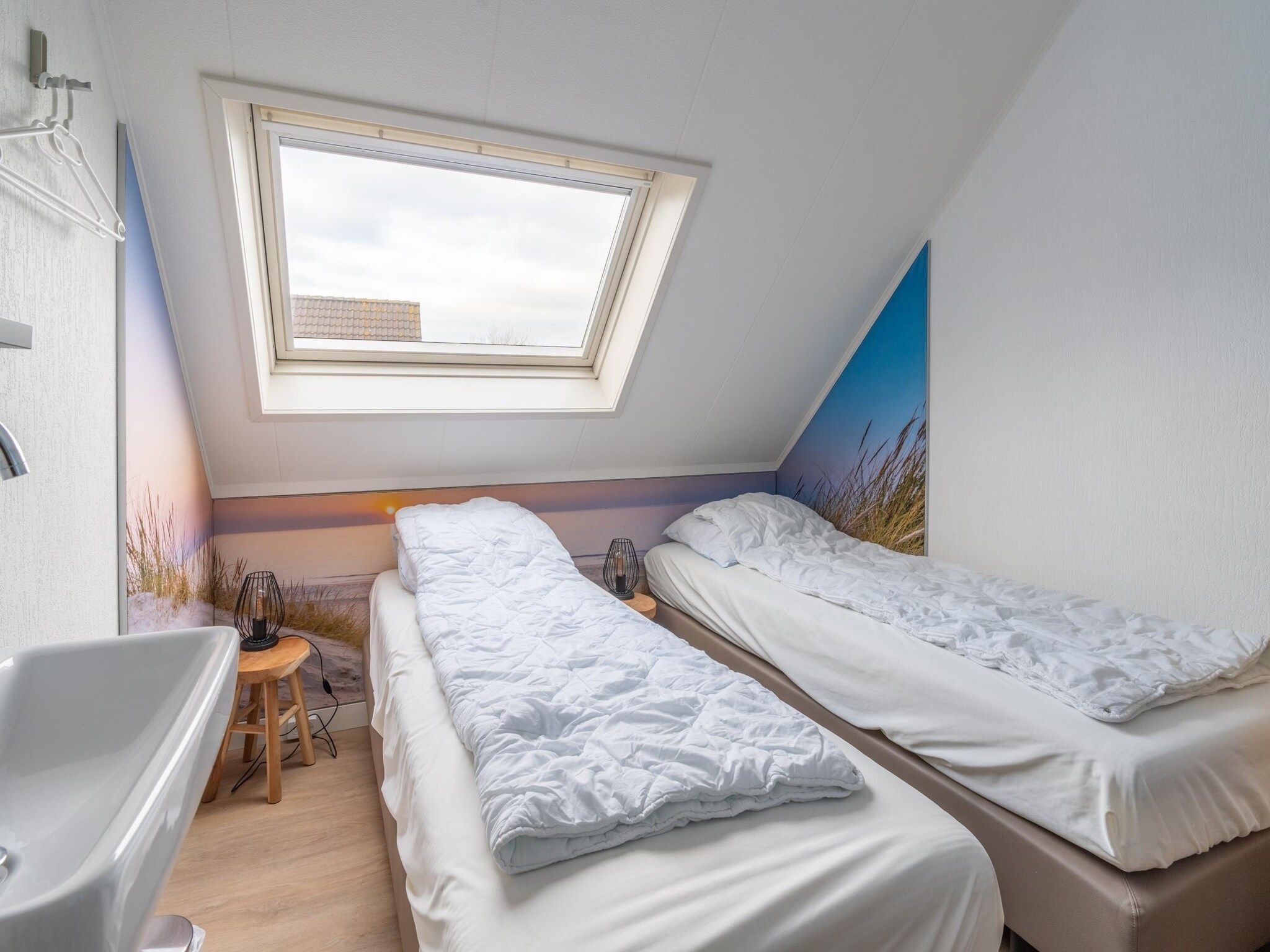 Een slaapkamer van Kamperfoelie 33 in De Koog