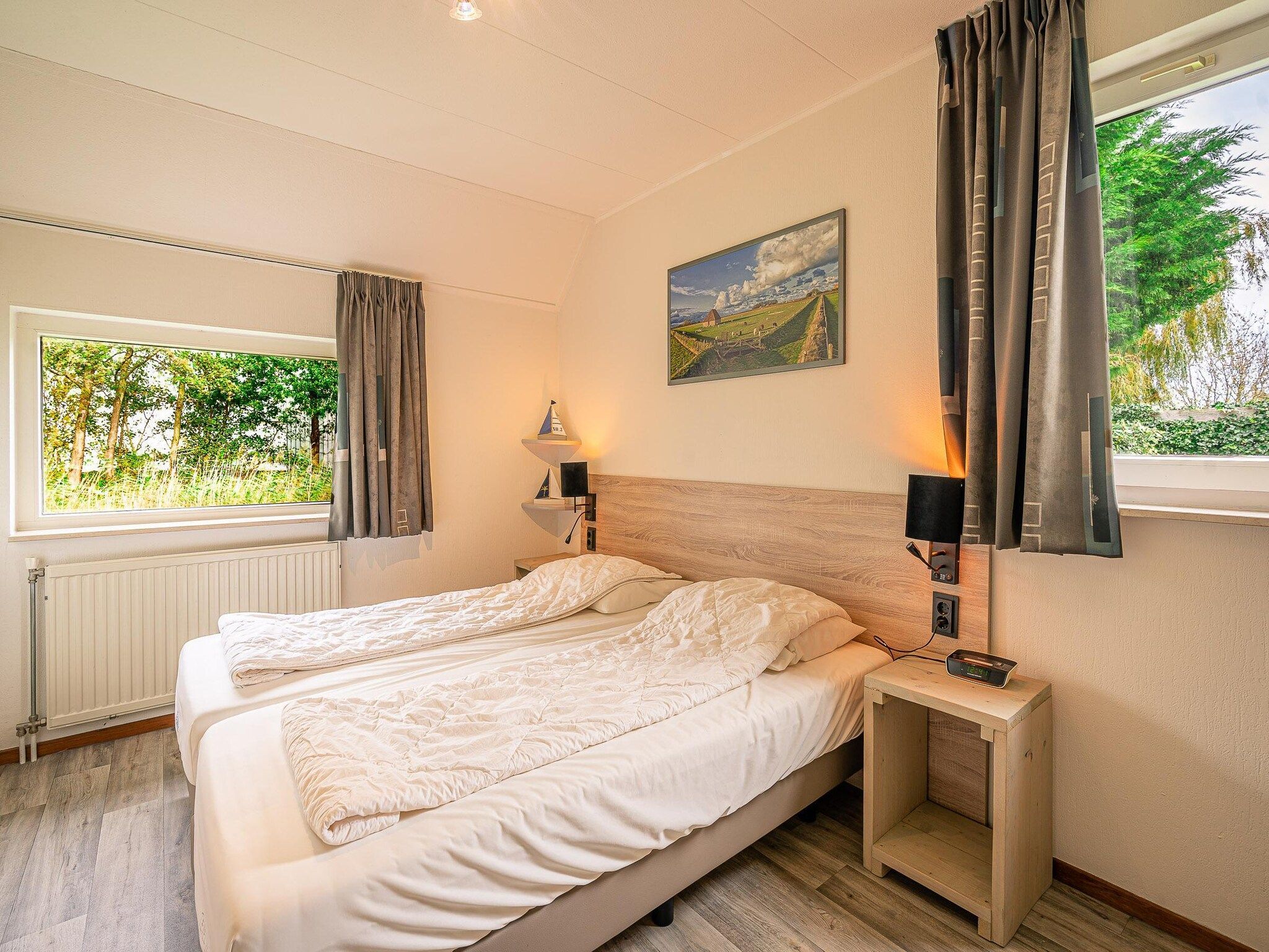 Een slaapkamer van Kamperfoelie 45 in De Koog