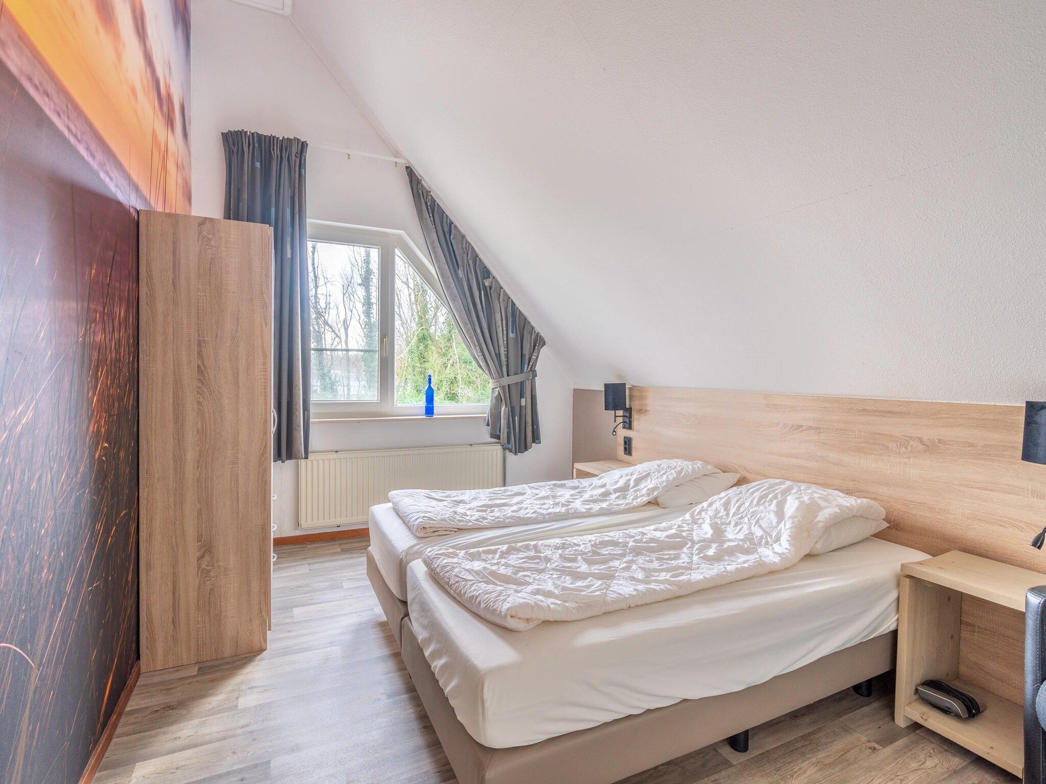 Een slaapkamer van Kamperfoelie 45 in De Koog