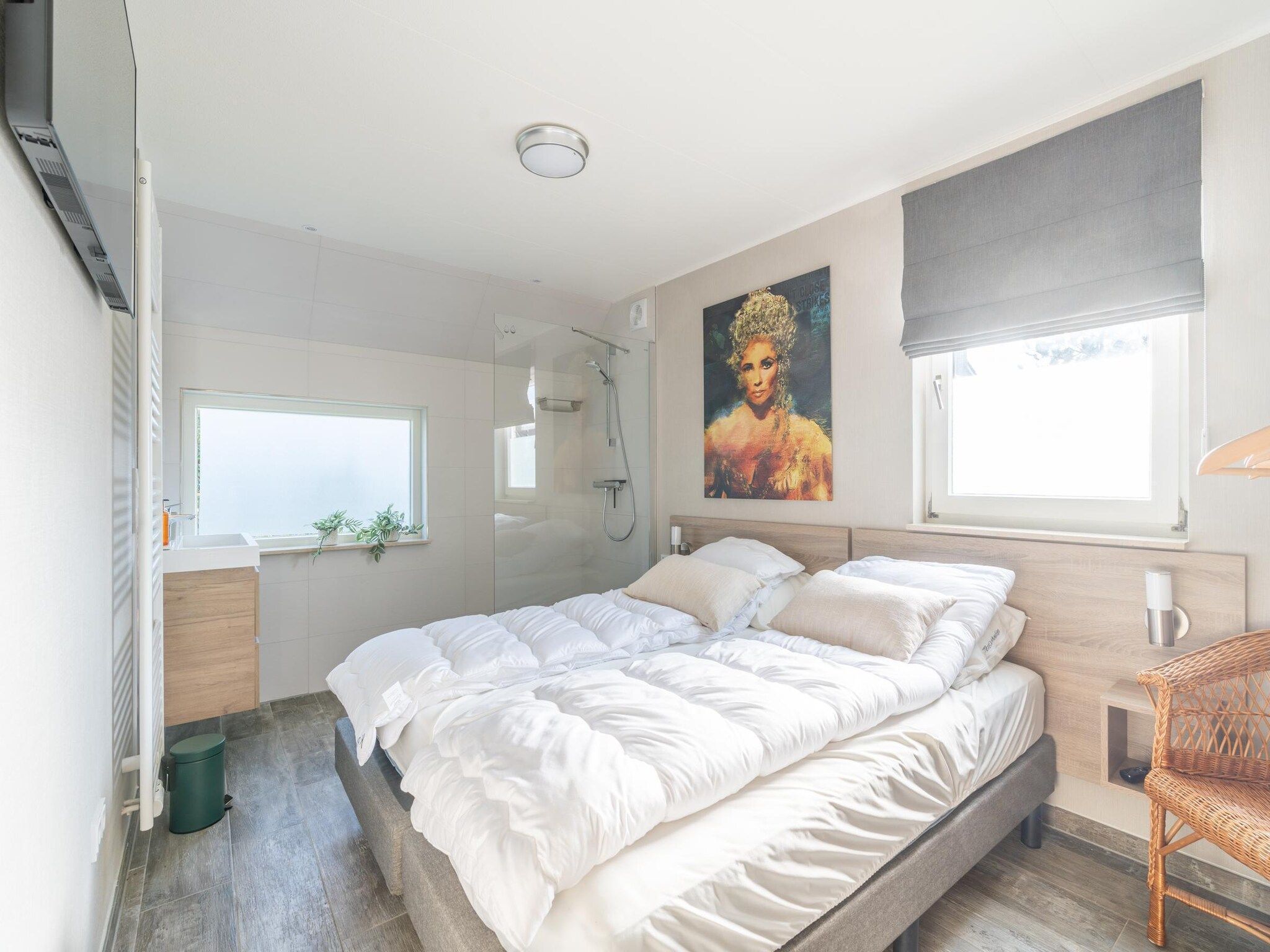 Een slaapkamer van Kamperfoelie 67 in De Koog