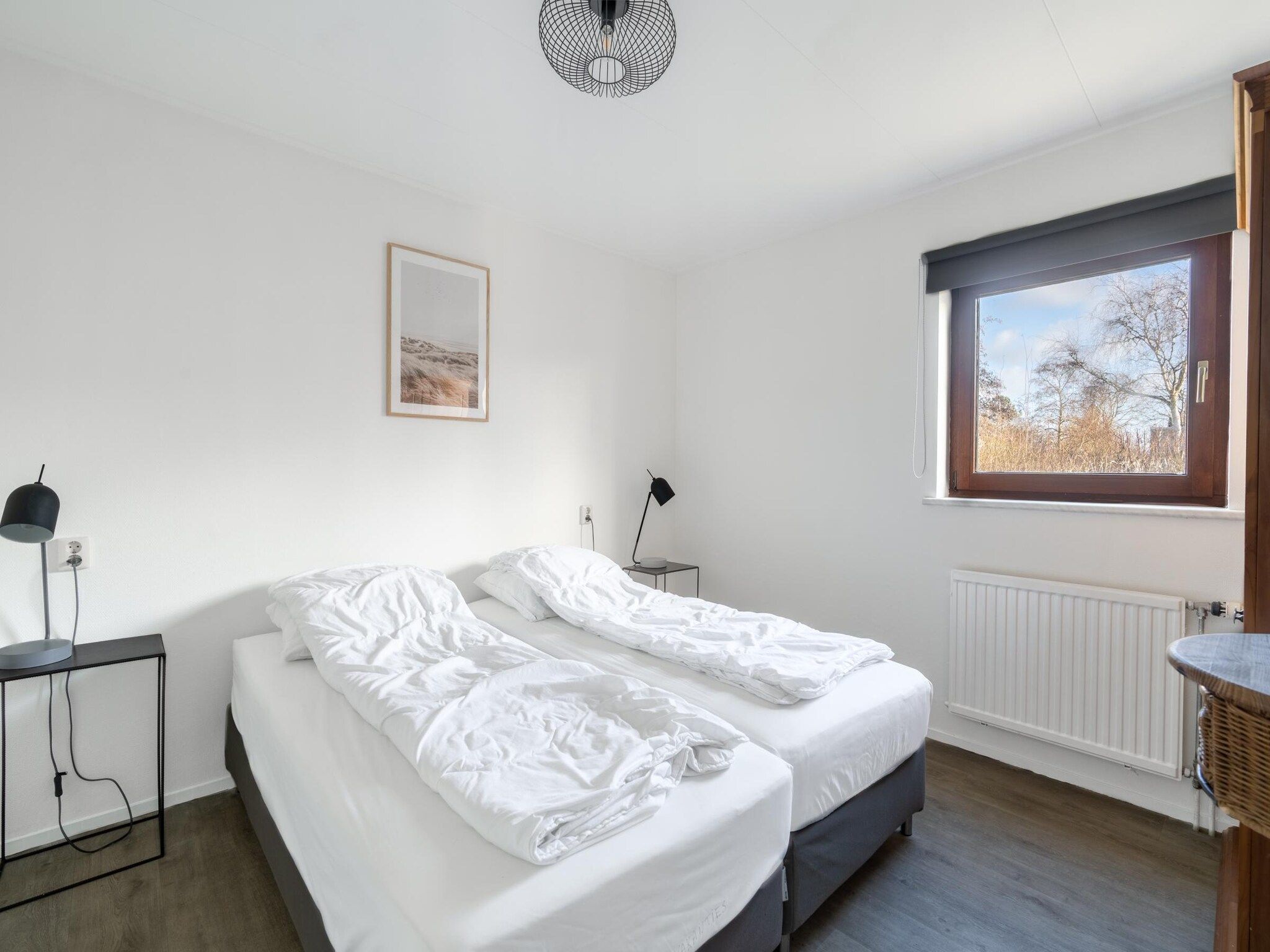 Een slaapkamer van De parel 164 in De Koog