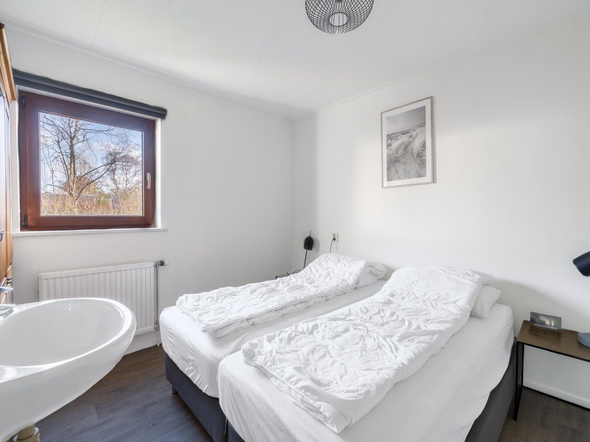 Een slaapkamer van De parel 164 in De Koog