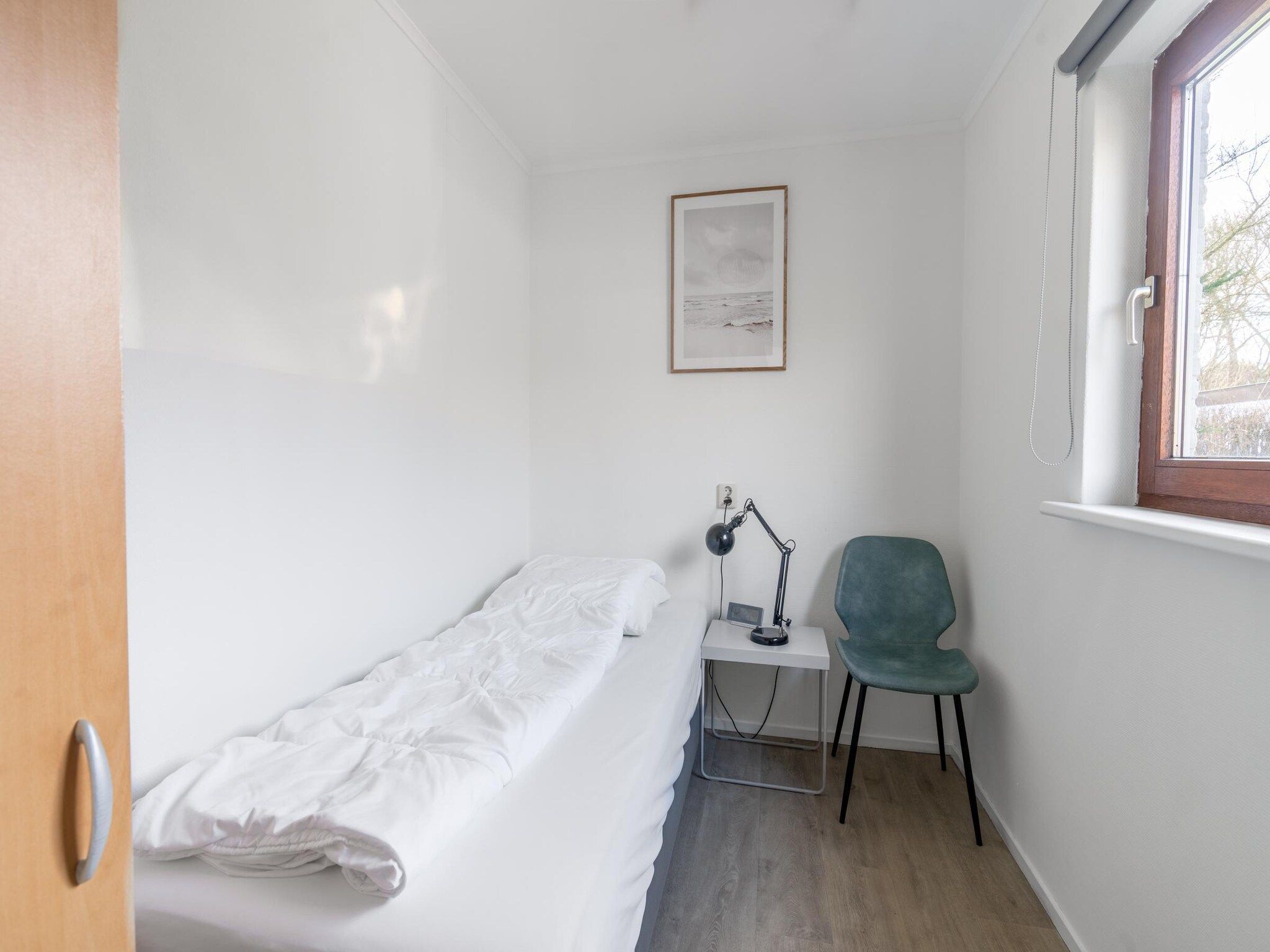 Een slaapkamer van De parel 164 in De Koog