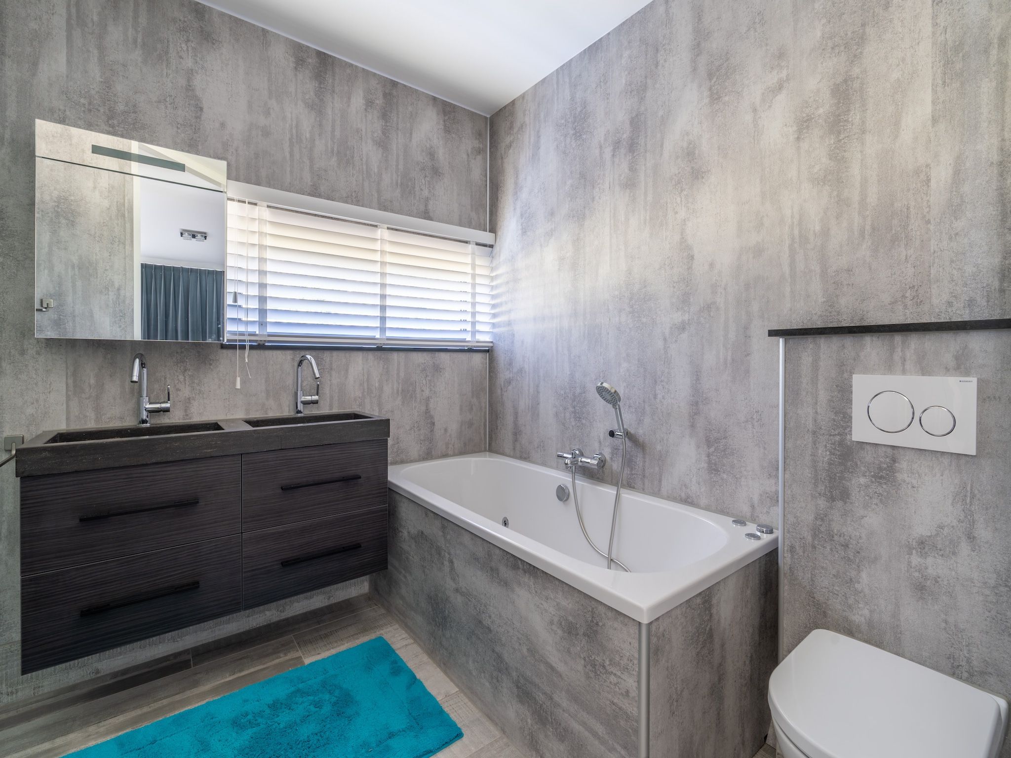 De badkamer van Strandvilla Hygge in Den Burg