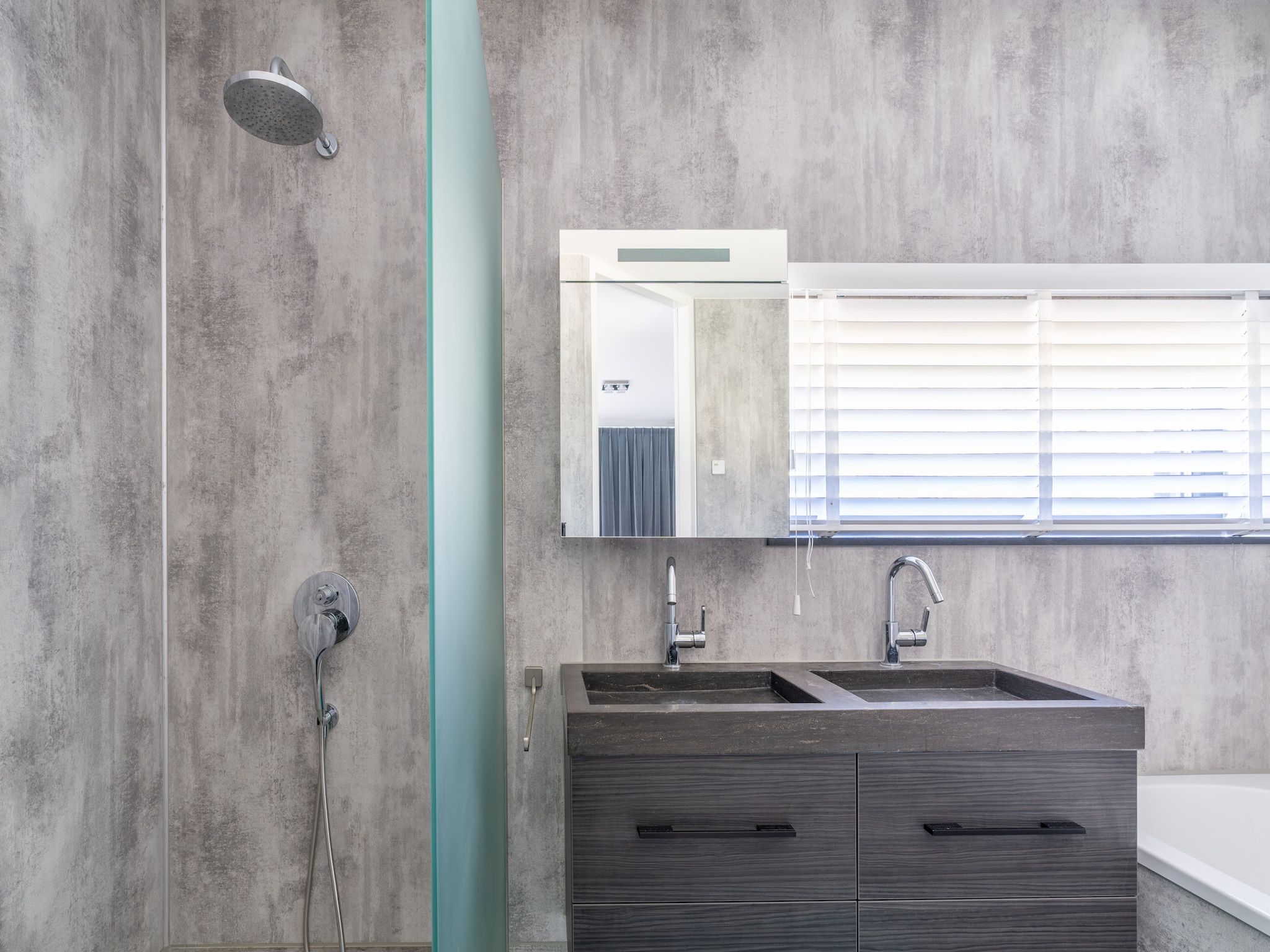 De badkamer van Strandvilla Hygge in Den Burg