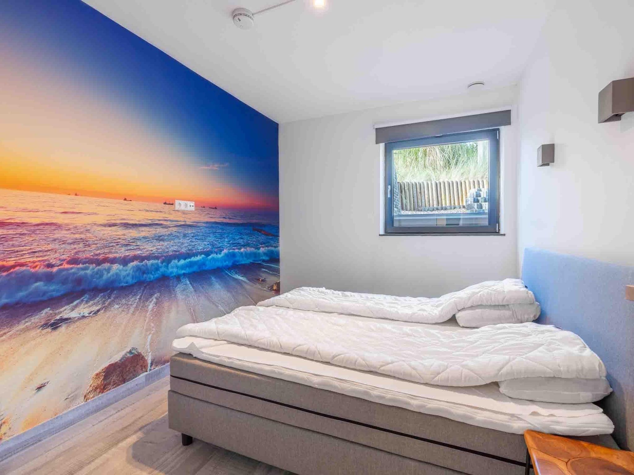 Een slaapkamer van Strandvilla Hygge in Den Burg