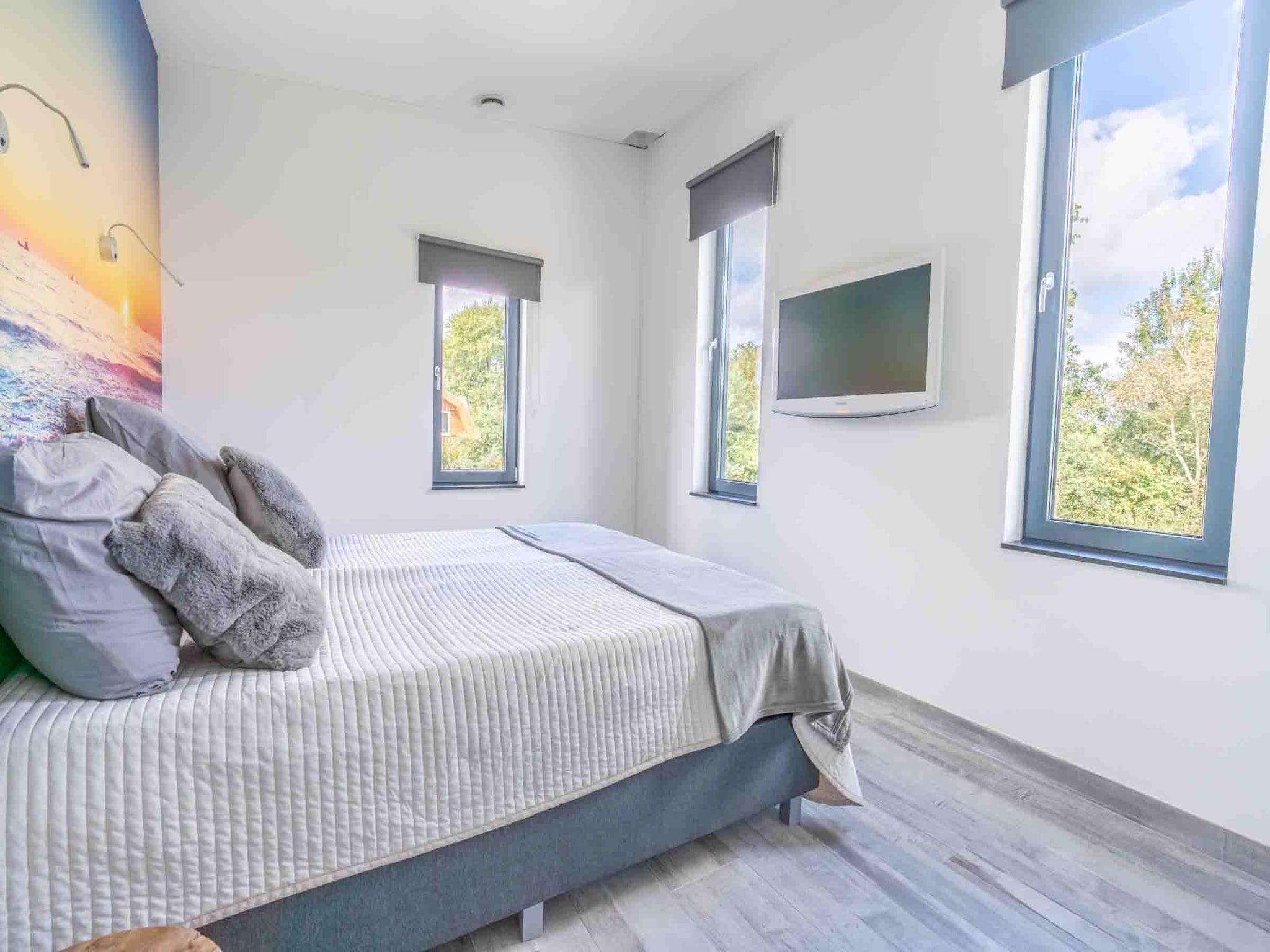 Een slaapkamer van Strandvilla Hygge in Den Burg