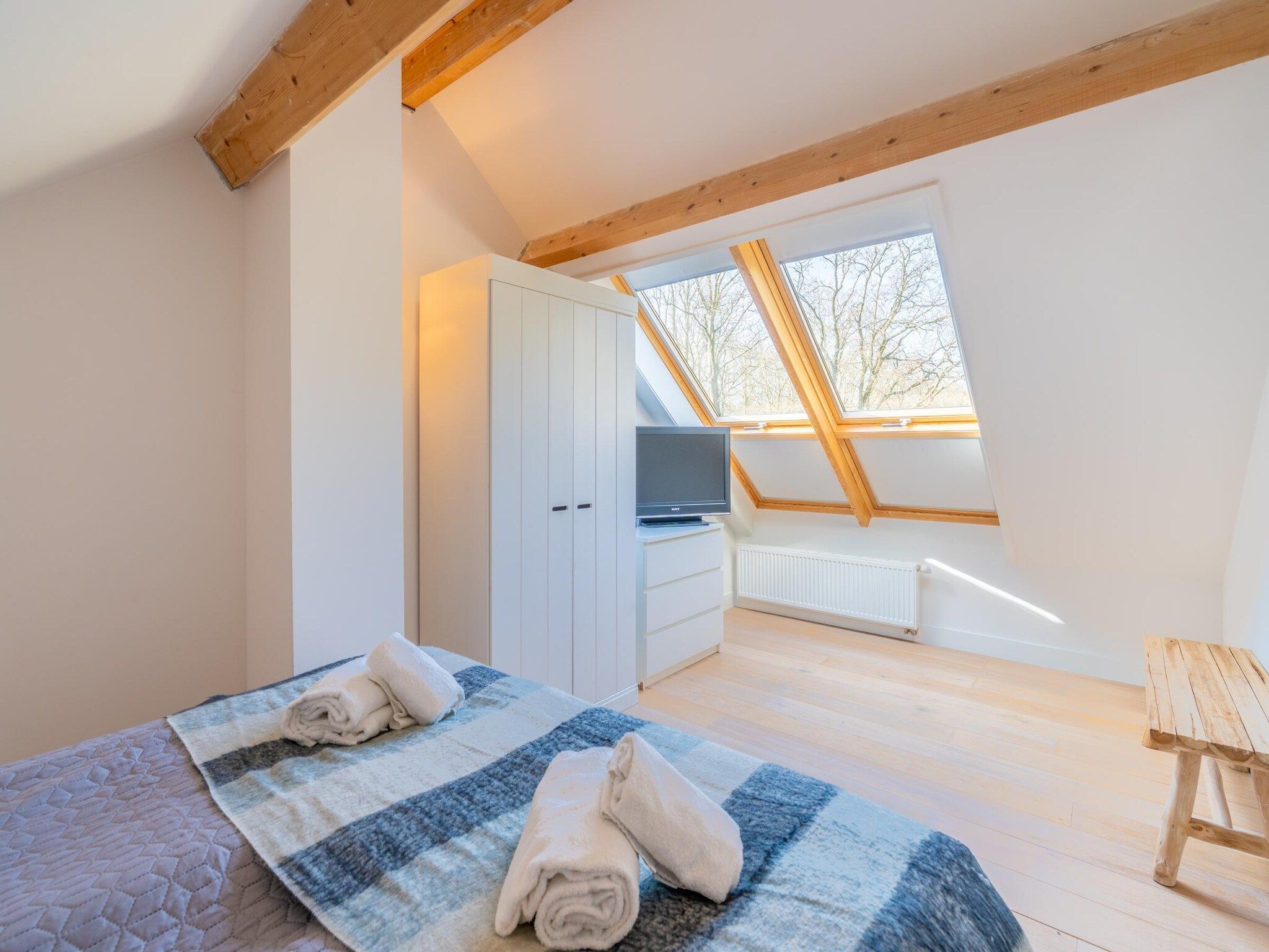 Een slaapkamer van De Wadden Parel 184 in Den Burg