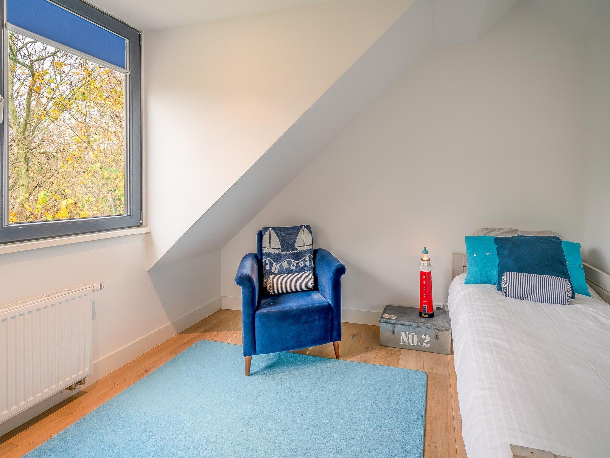 Een slaapkamer van De Wadden Parel 184 in Den Burg