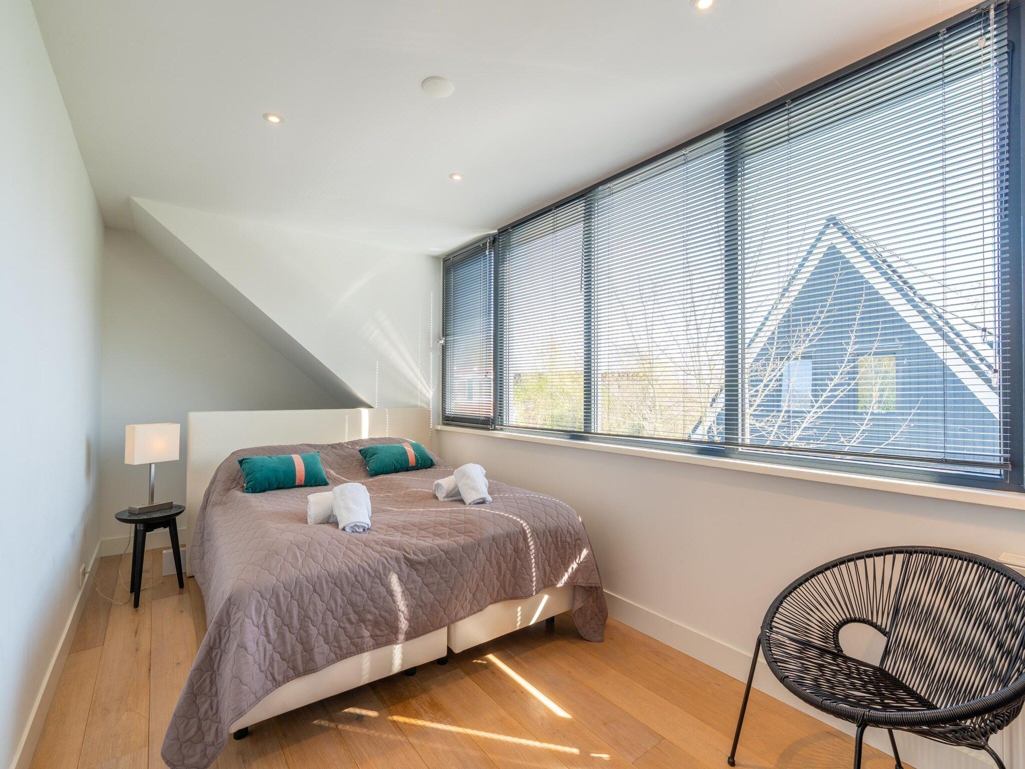 Een slaapkamer van De Wadden Parel 184 in Den Burg