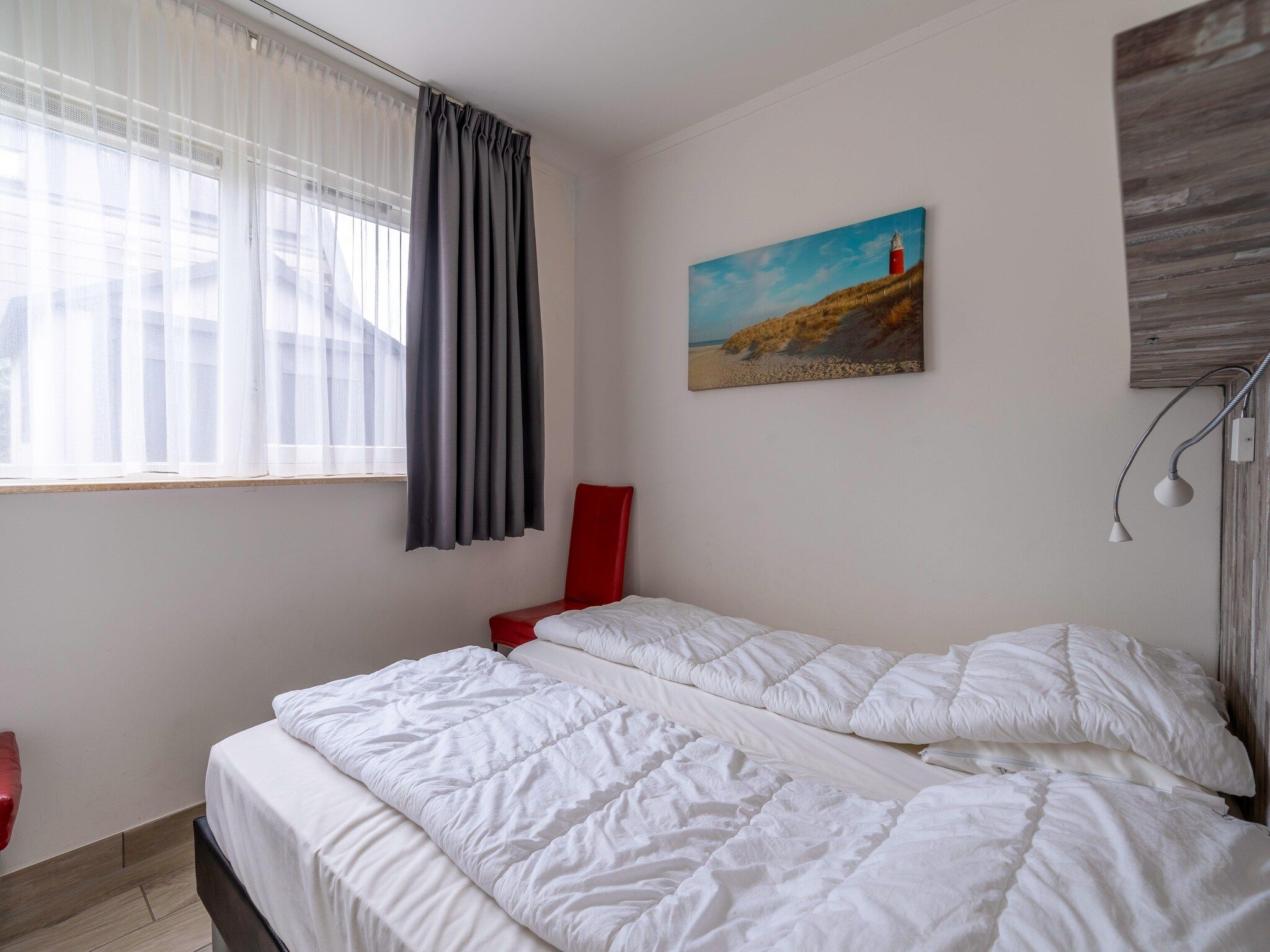 Een slaapkamer van Texelfan Californieweg 9A in De Koog