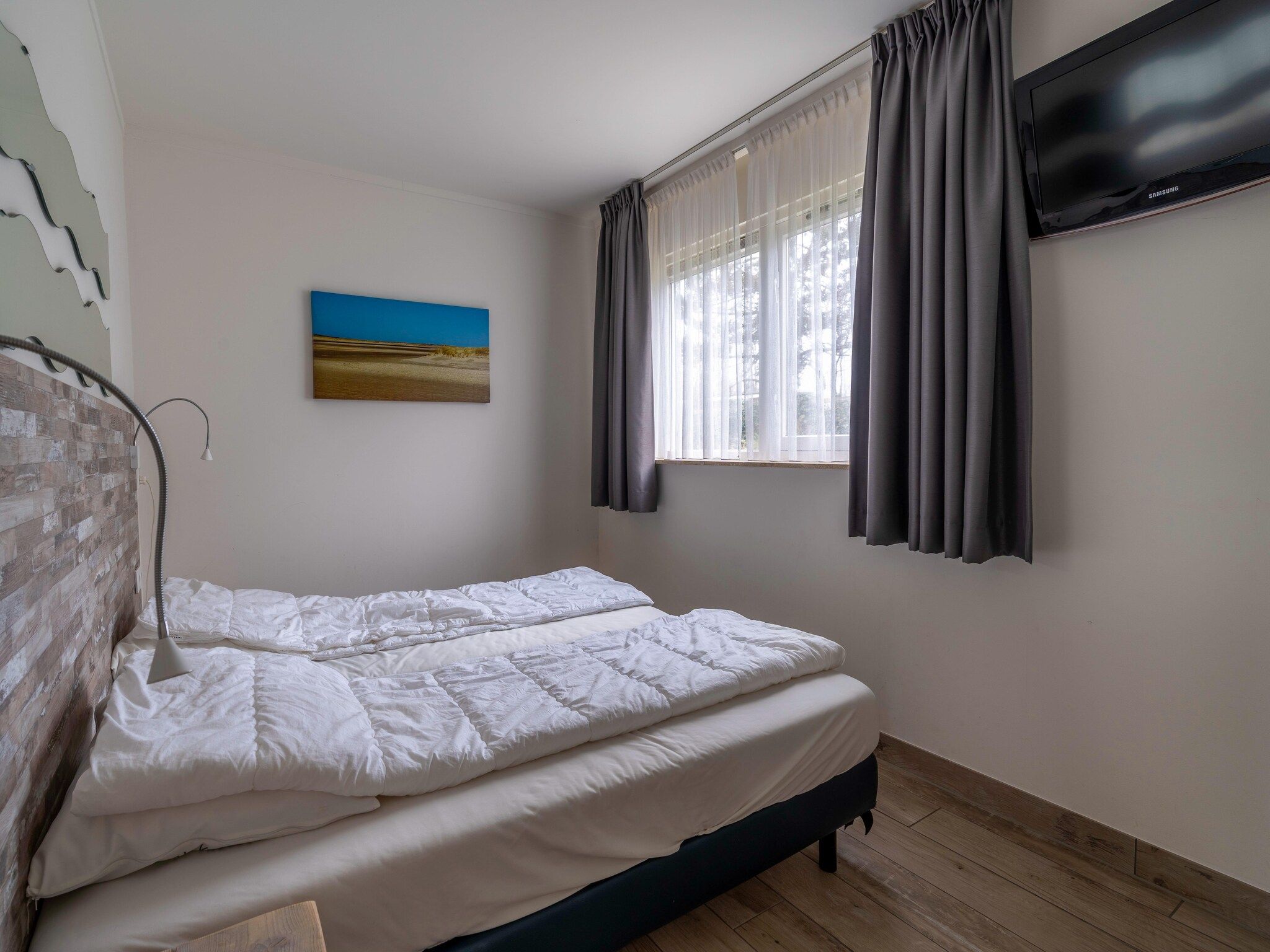 Een slaapkamer van Texelfan Californieweg 9A in De Koog