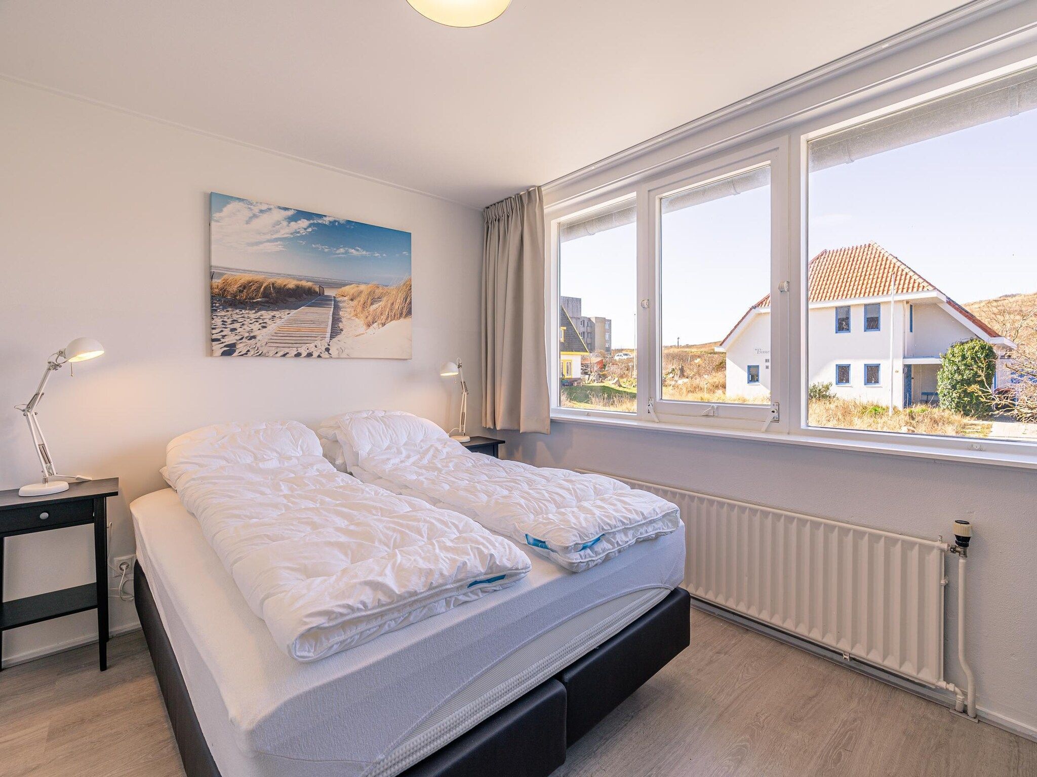 Een slaapkamer van De Zandduyn 13A in De Koog