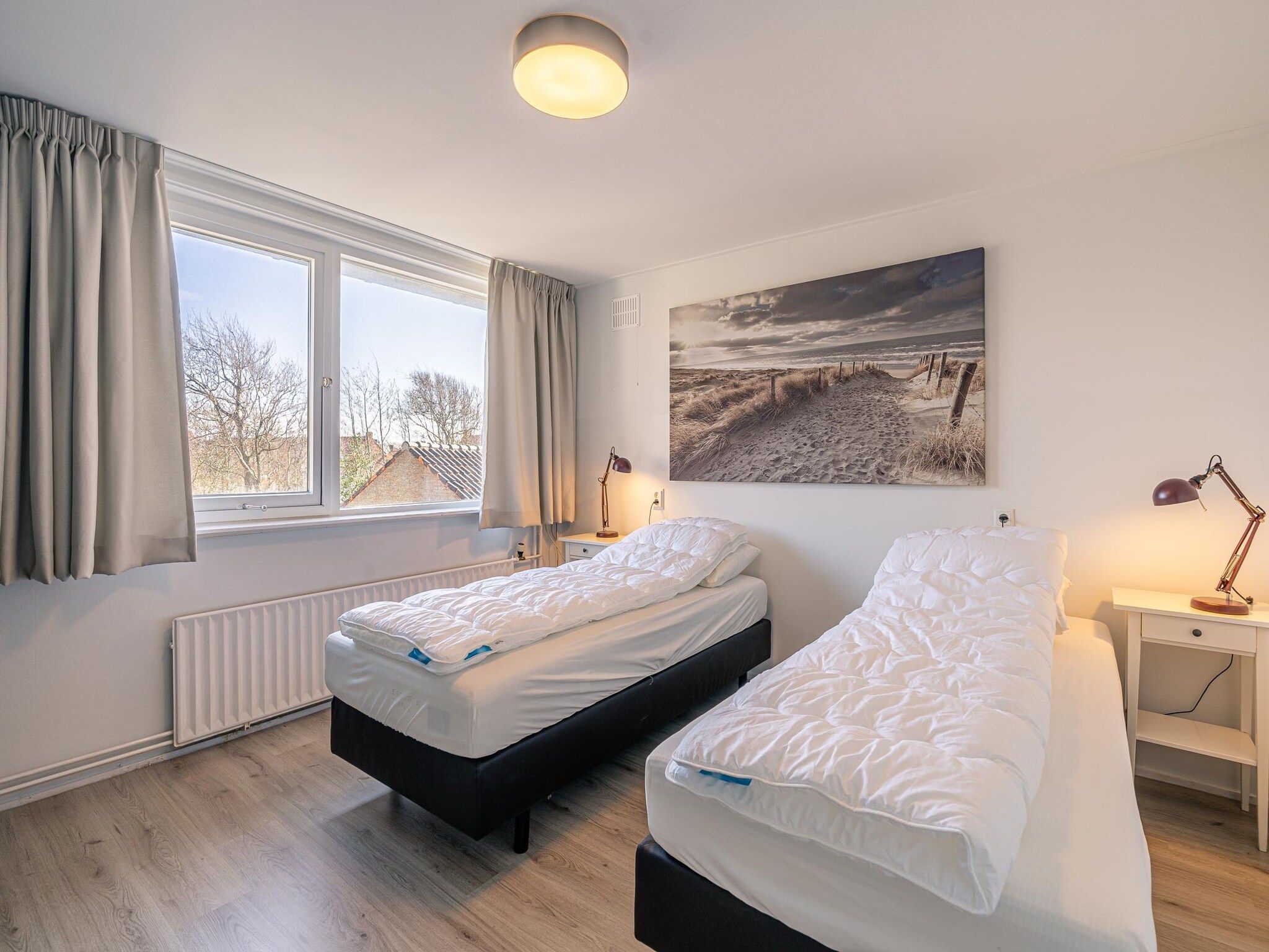 Een slaapkamer van De Zandduyn 13A in De Koog