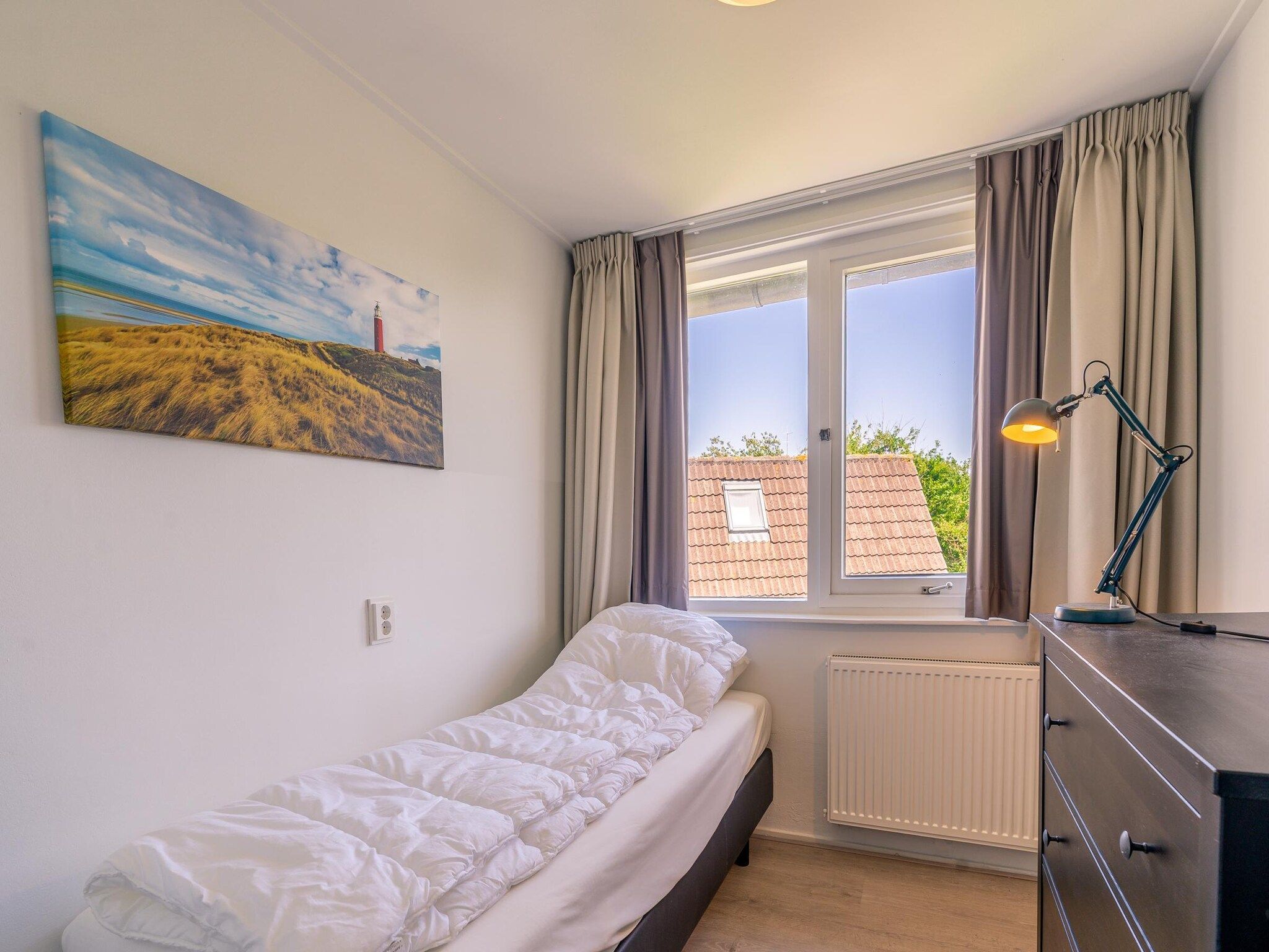 Een slaapkamer van De Zandduyn 13A in De Koog