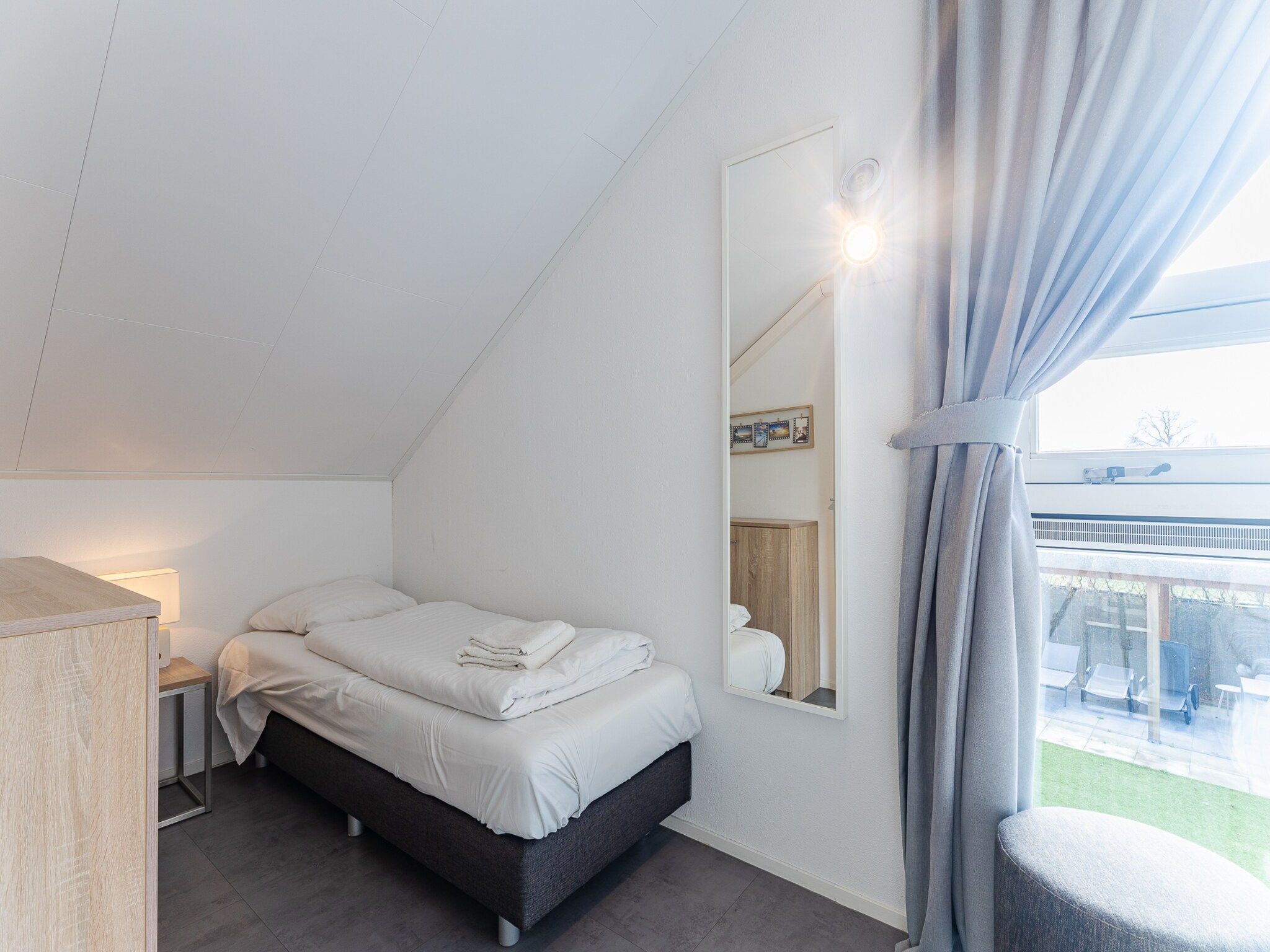 Een slaapkamer van Zonnedorp 7 De Meerpaal in Renesse | Comfortable holiday house close to the beach in Renesse