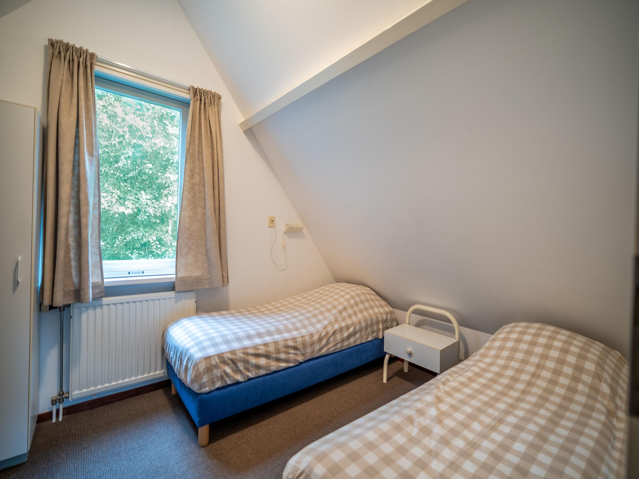 Een slaapkamer van Nieuwlanderweg 51 in De Waal