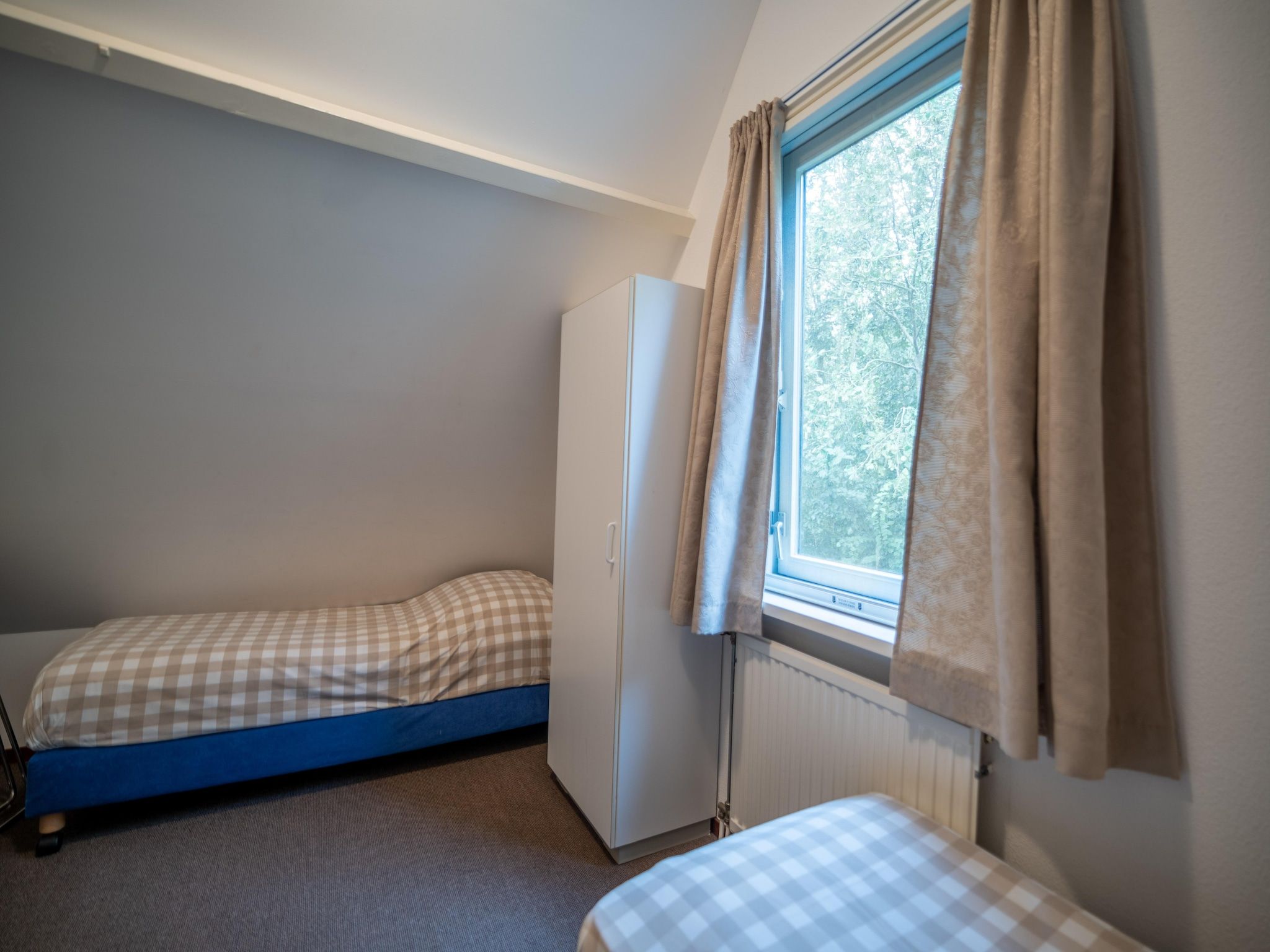 Een slaapkamer van Nieuwlanderweg 51 in De Waal