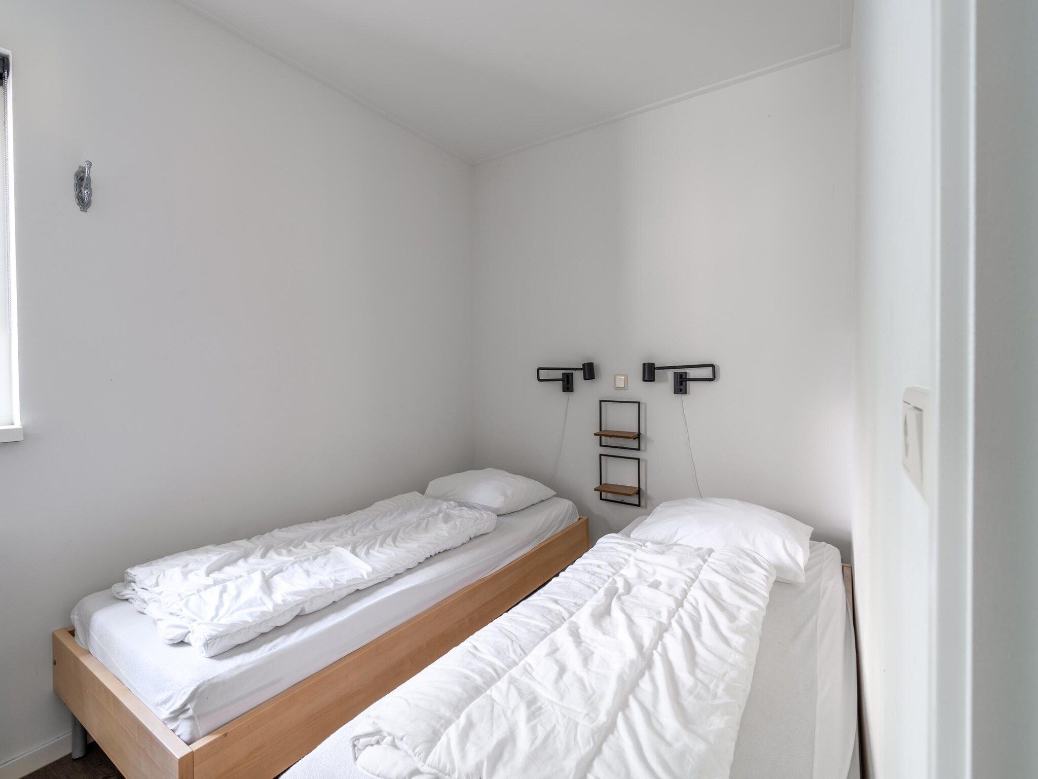 Een slaapkamer van Pelikaanweg 21 in De Koog