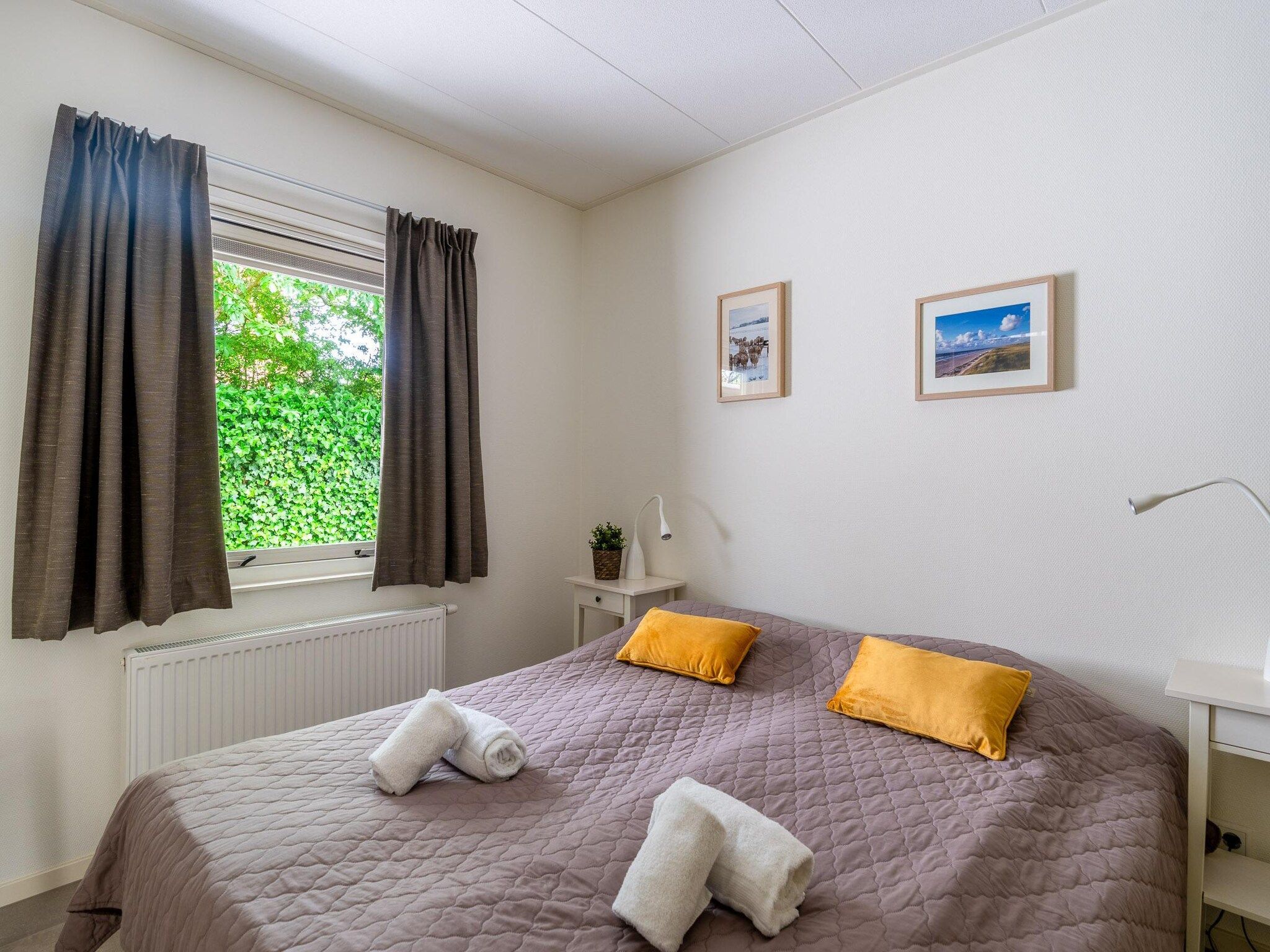 Een slaapkamer van Tempelierweg 23 in Den Burg