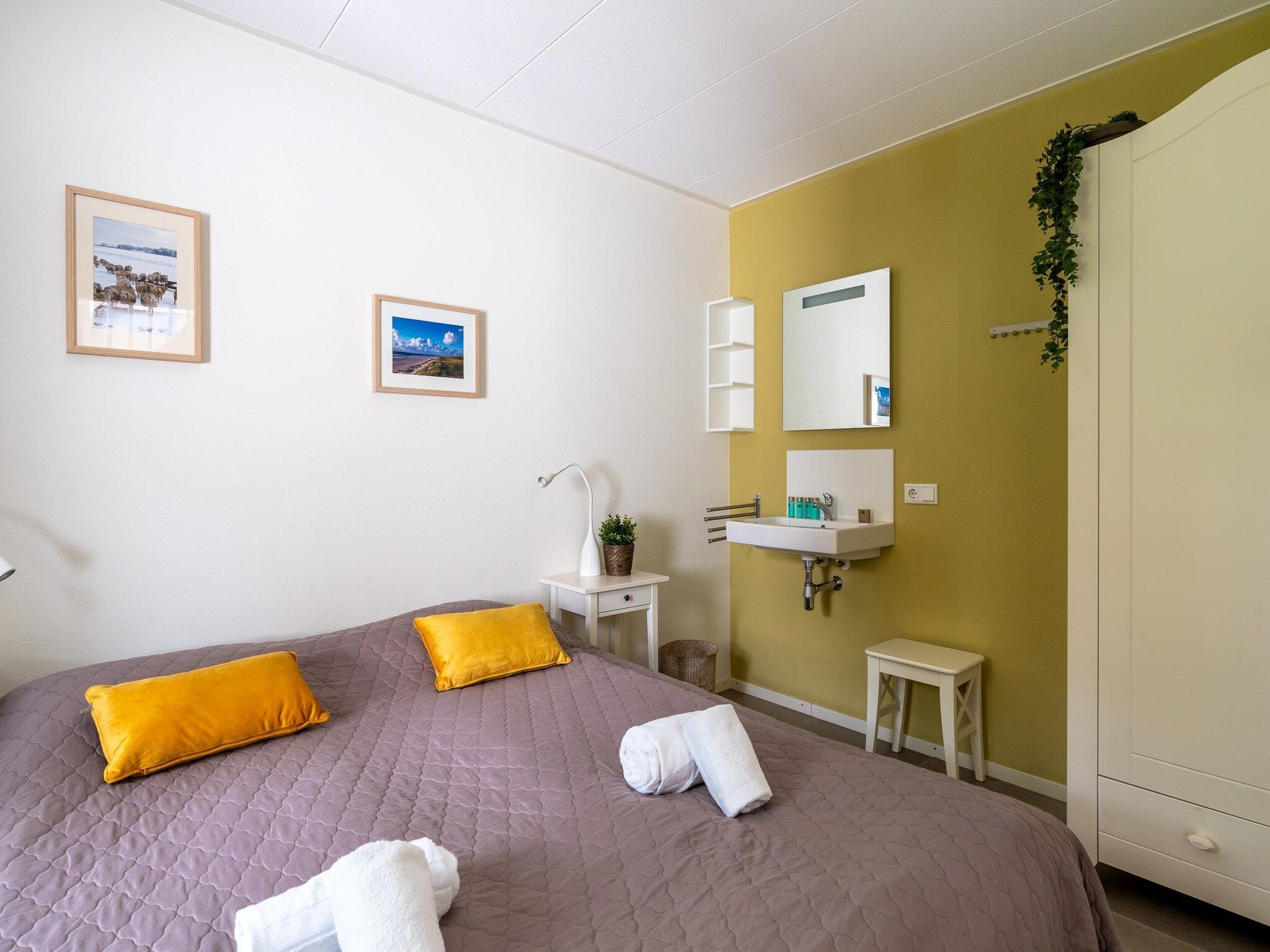 Een slaapkamer van Tempelierweg 23 in Den Burg