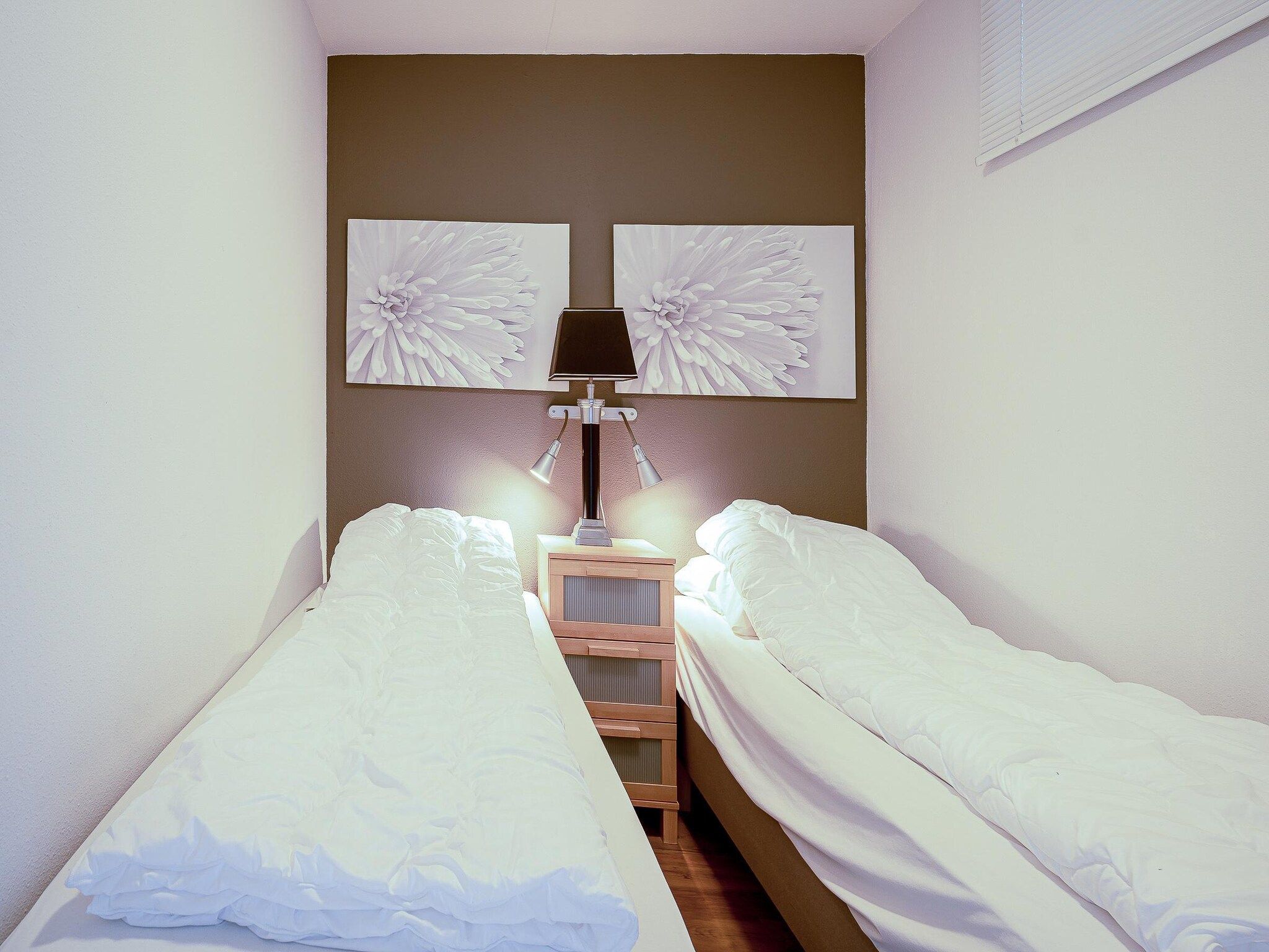 Een slaapkamer van Juliana 042 in De Koog