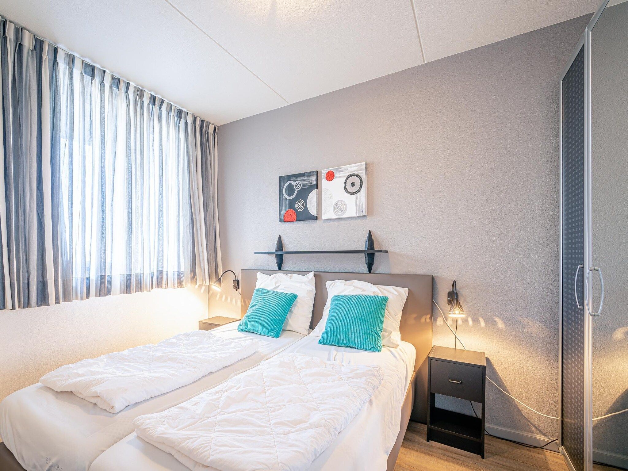 Een slaapkamer van Juliana 046 in De Koog