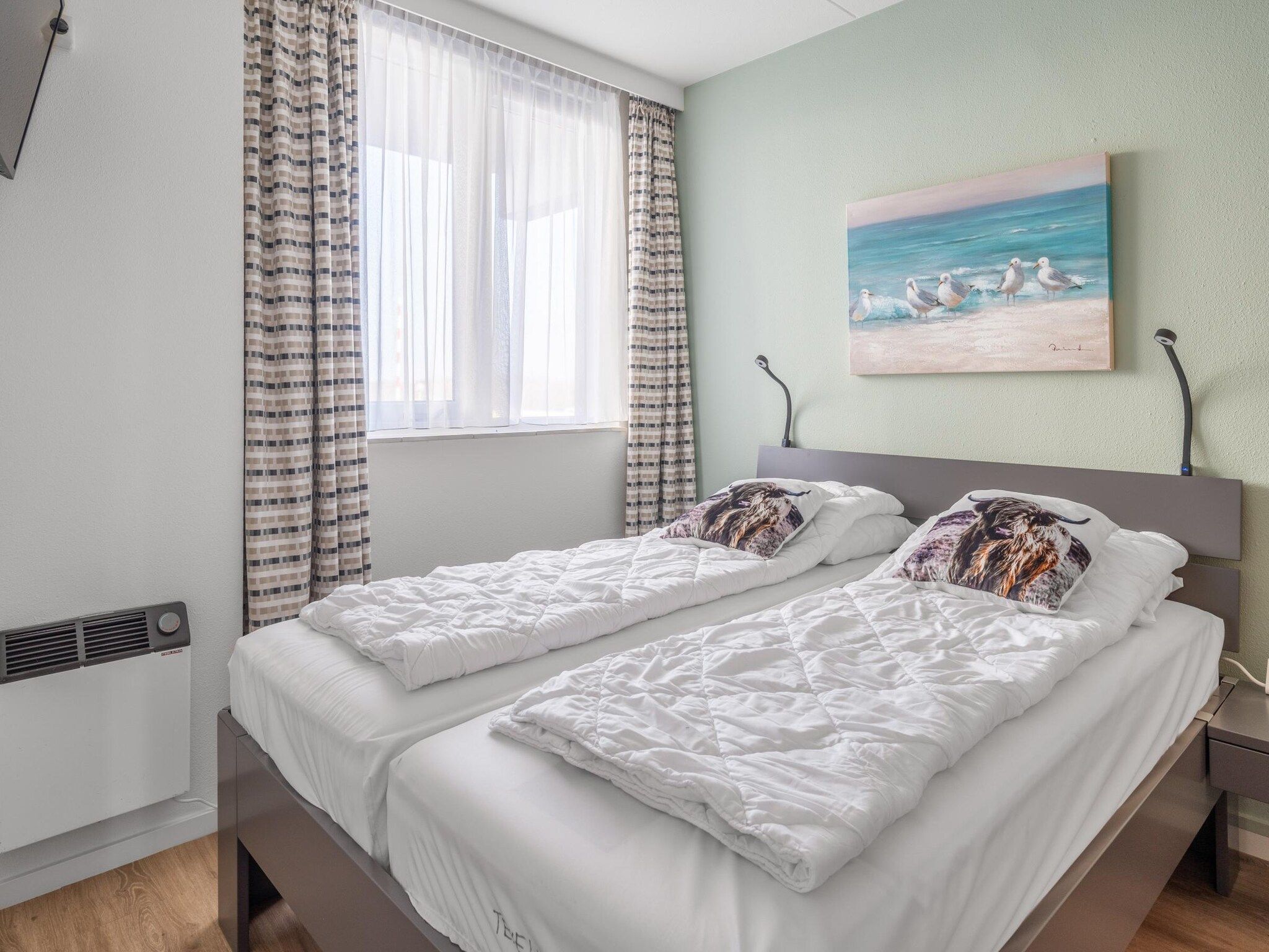 Een slaapkamer van Juliana 050 in De Koog