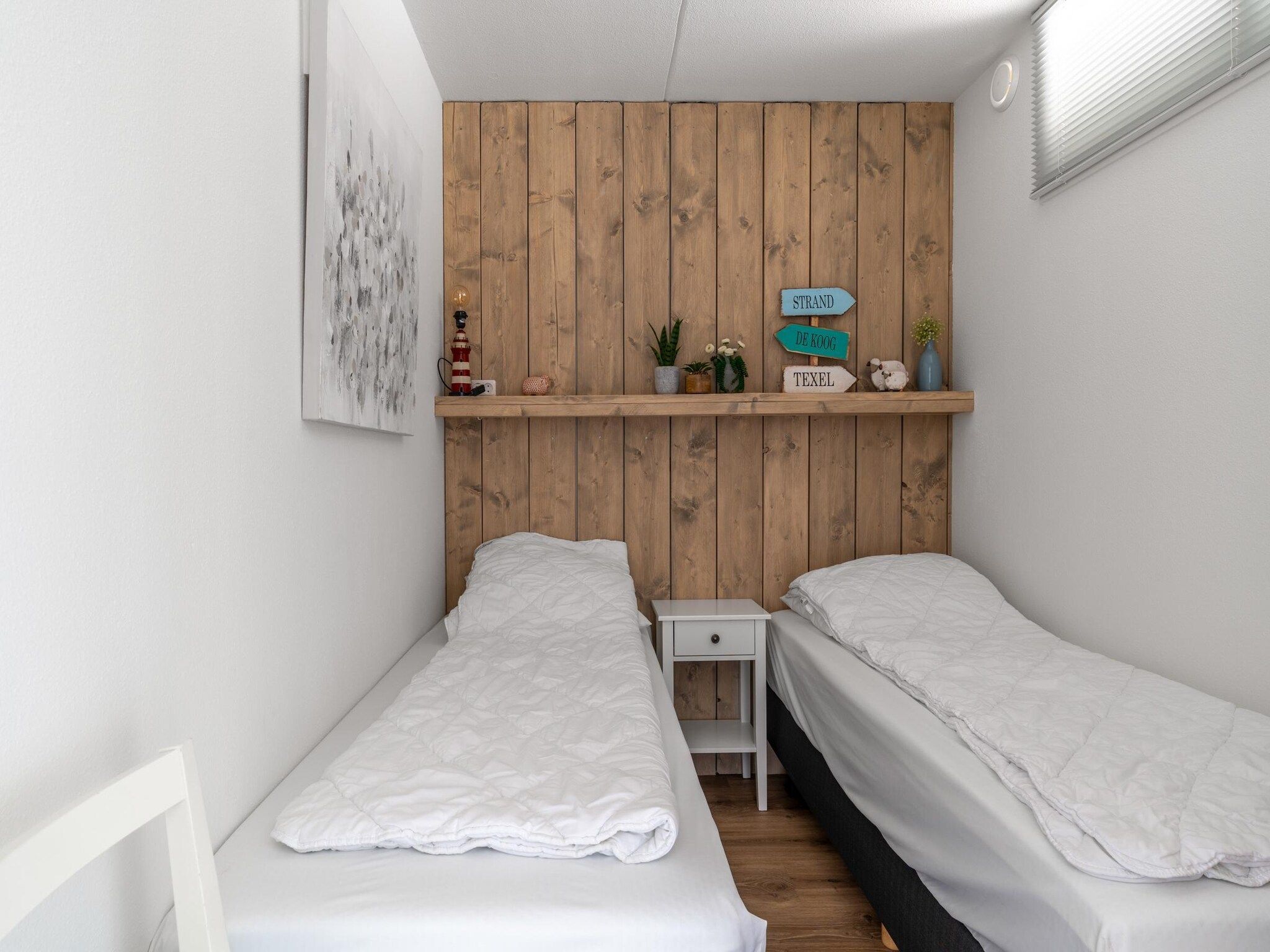 Een slaapkamer van Juliana 050 in De Koog