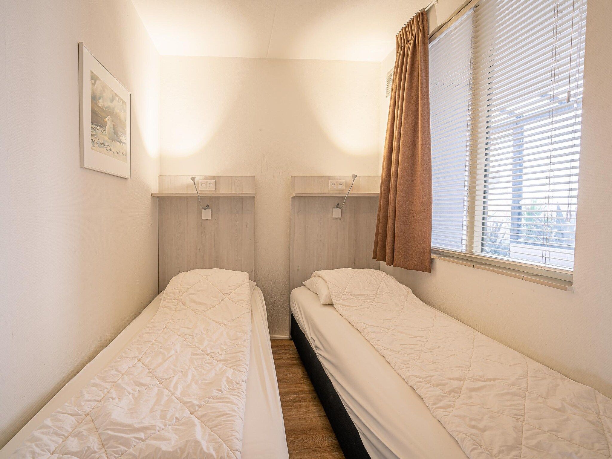 Een slaapkamer van Juliana 056 in De Koog