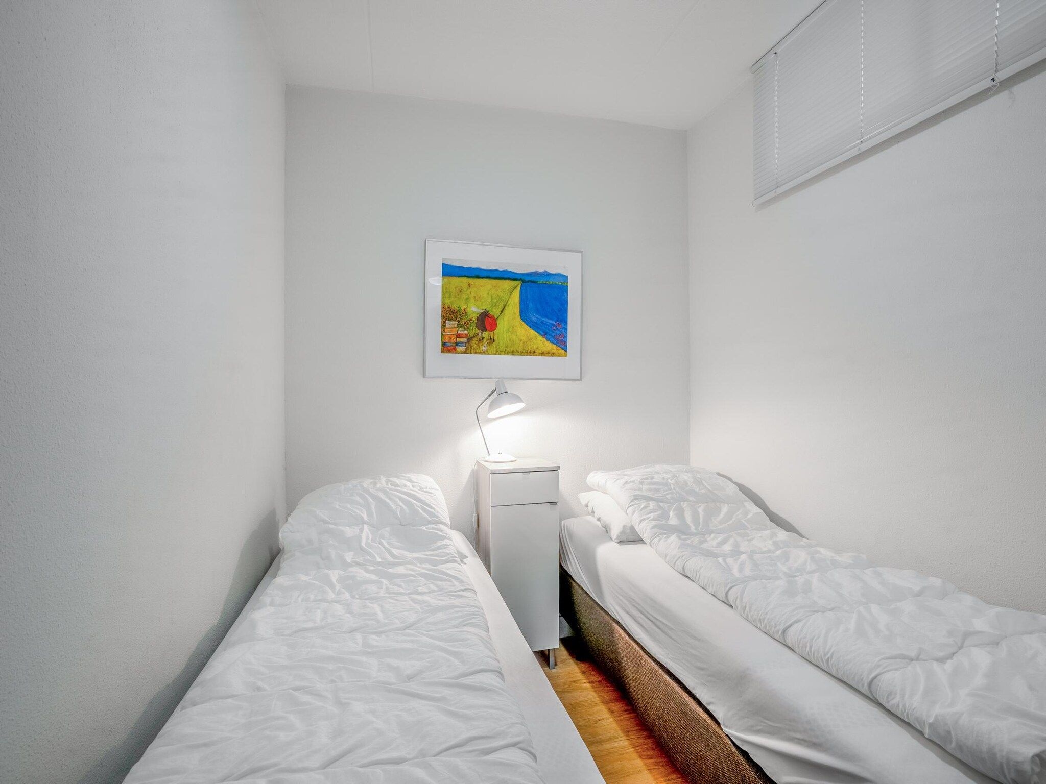 Een slaapkamer van Juliana 052 in De Koog