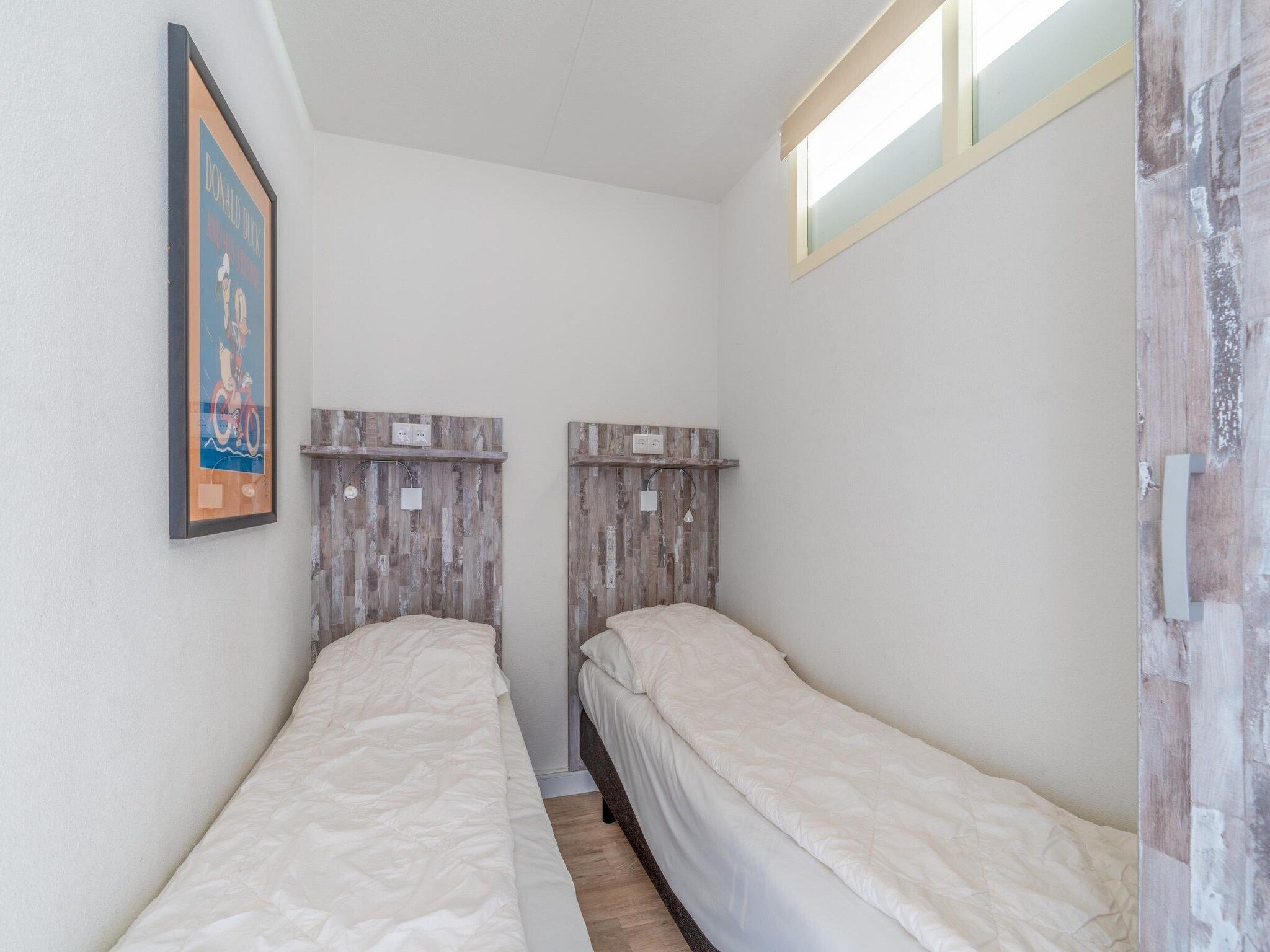 Een slaapkamer van Juliana 138 in De Koog