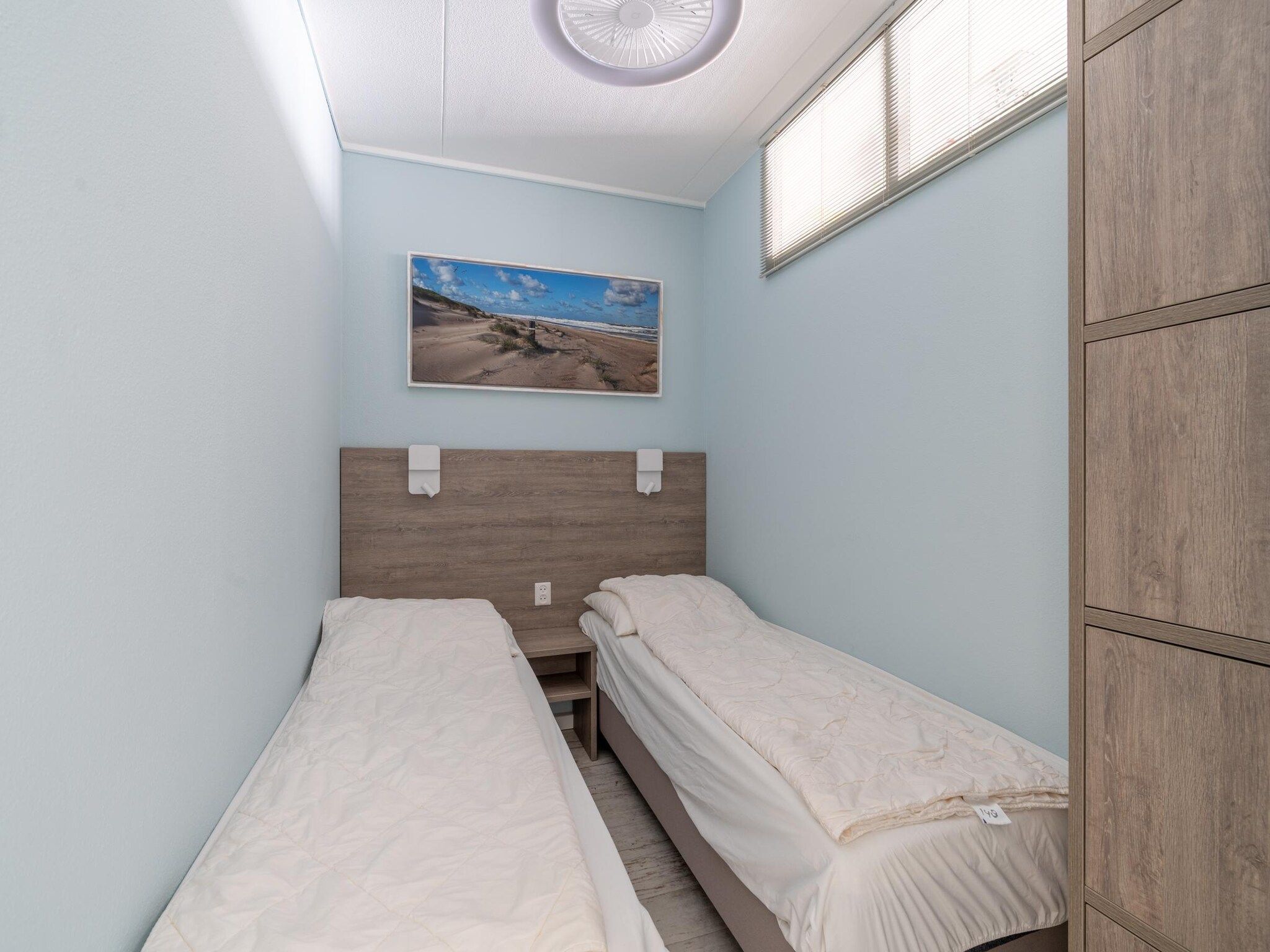 Een slaapkamer van Juliana 148 in De Koog