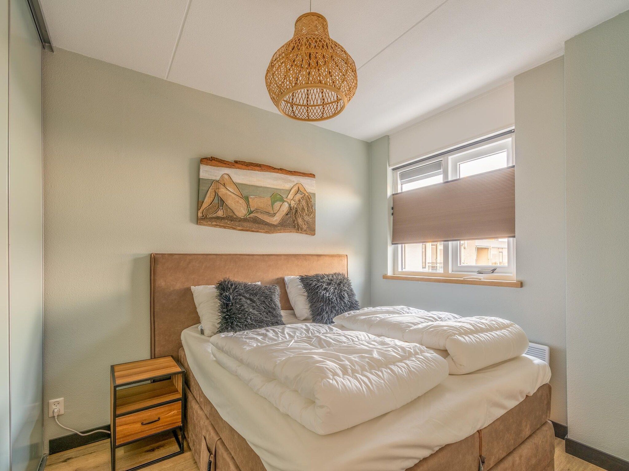 Een slaapkamer van Juliana 140 in De Koog