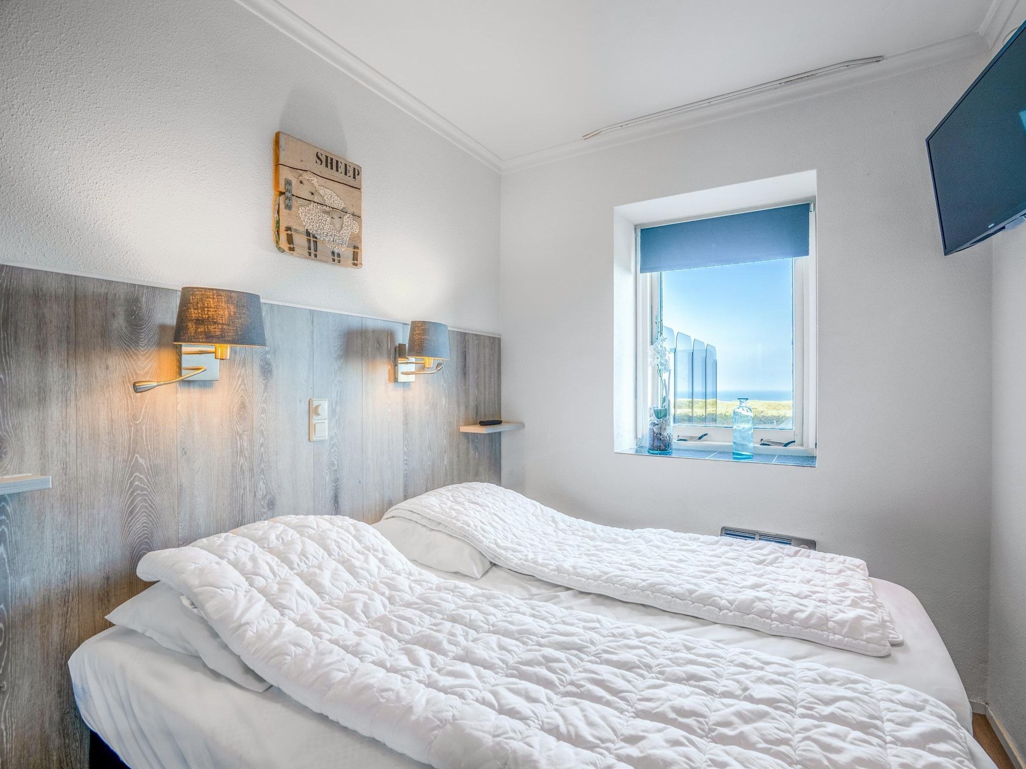 Een slaapkamer van Juliana 058 in De Koog