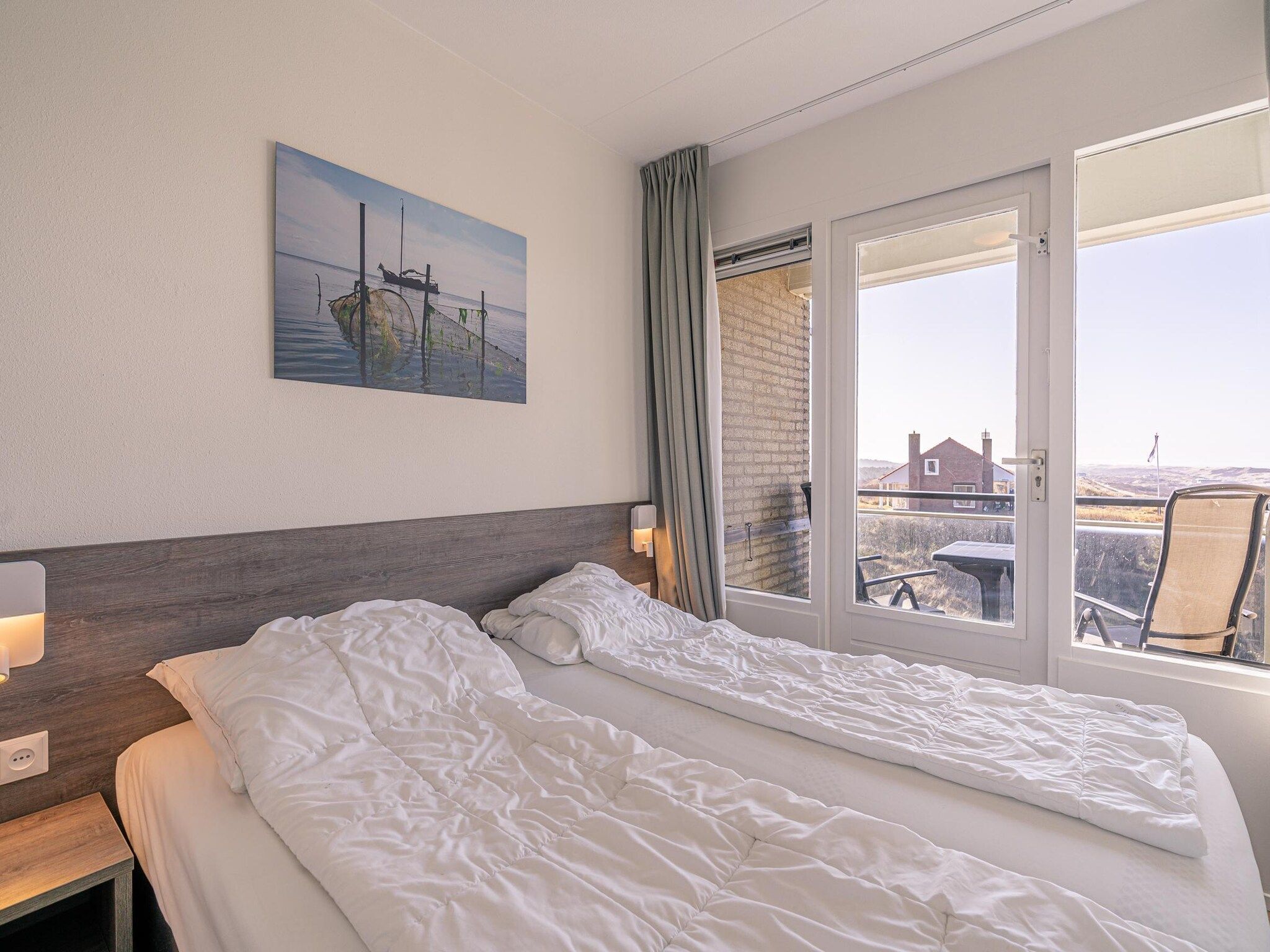 Een slaapkamer van Juliana 150 in De Koog