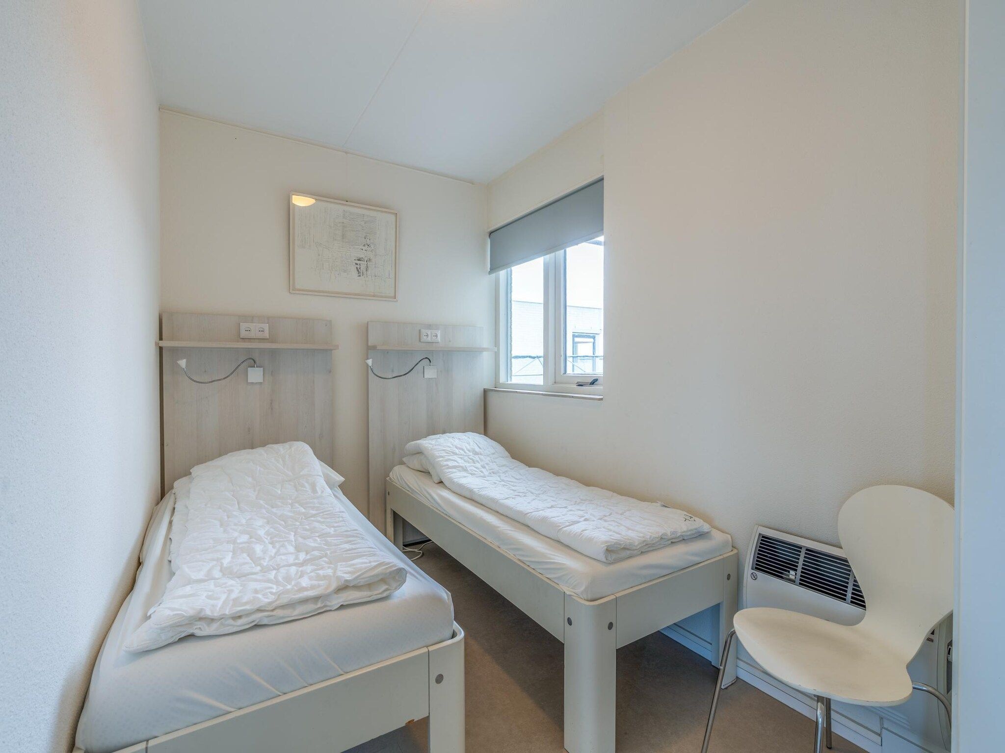 Een slaapkamer van Juliana 152 in De Koog