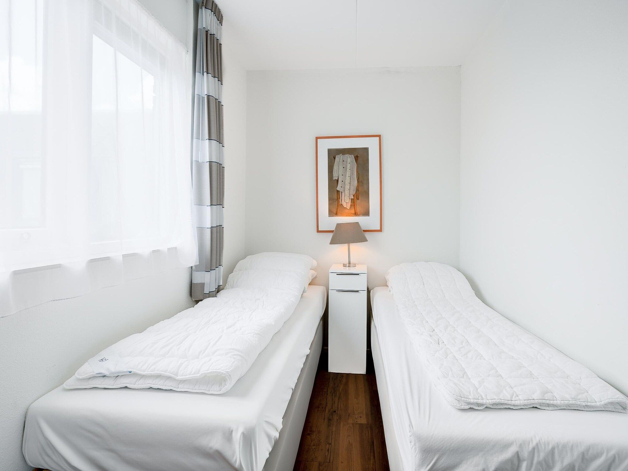 Een slaapkamer van Juliana 154 in De Koog