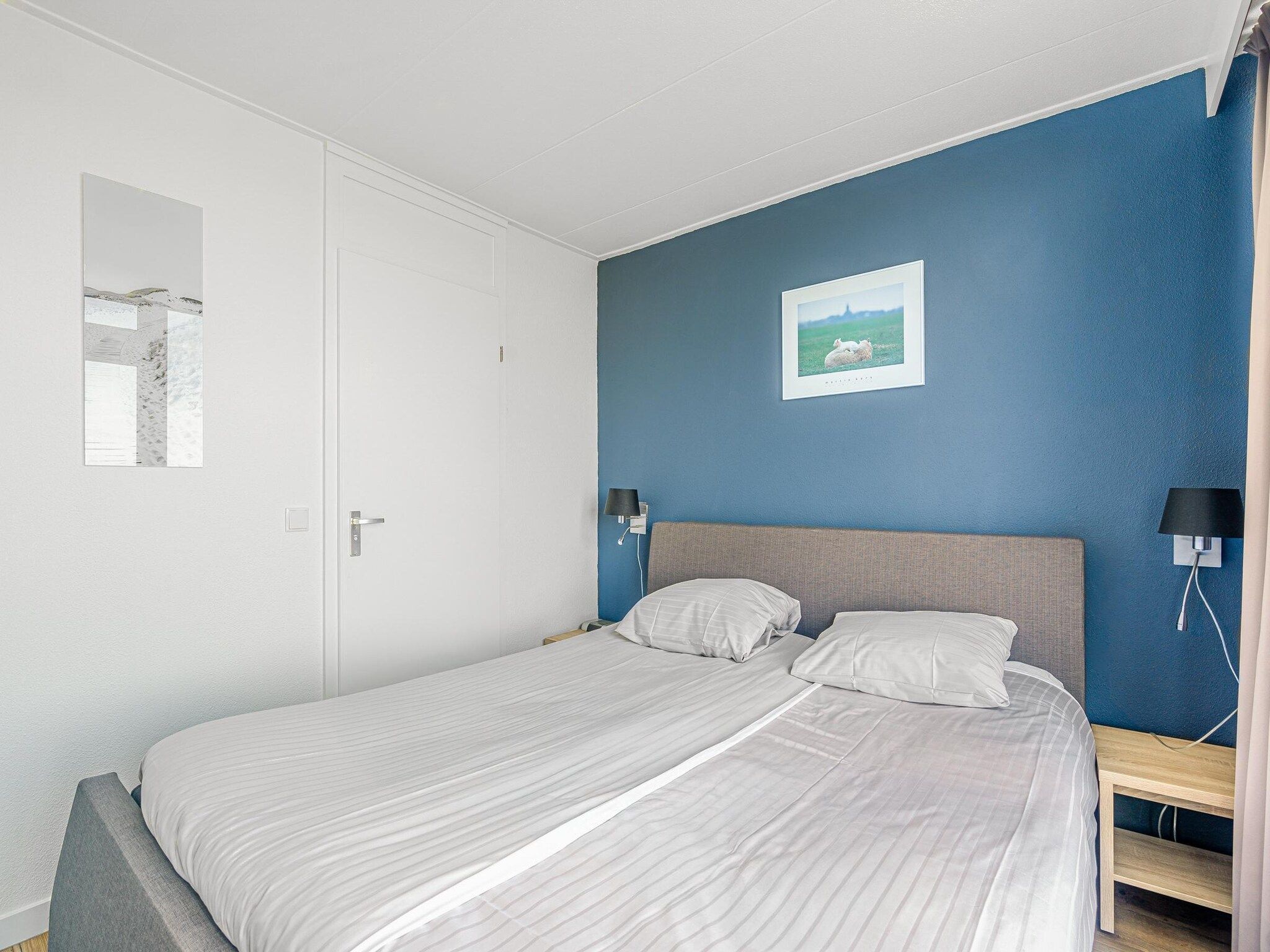 Een slaapkamer van Juliana 060 in De Koog