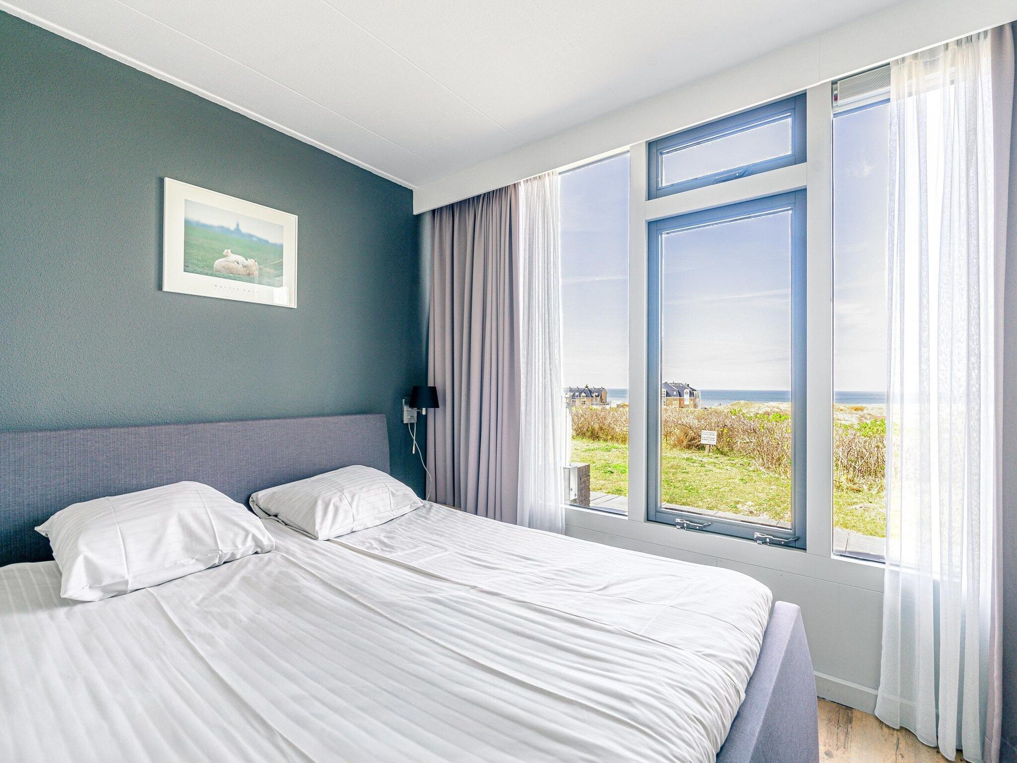 Een slaapkamer van Juliana 060 in De Koog