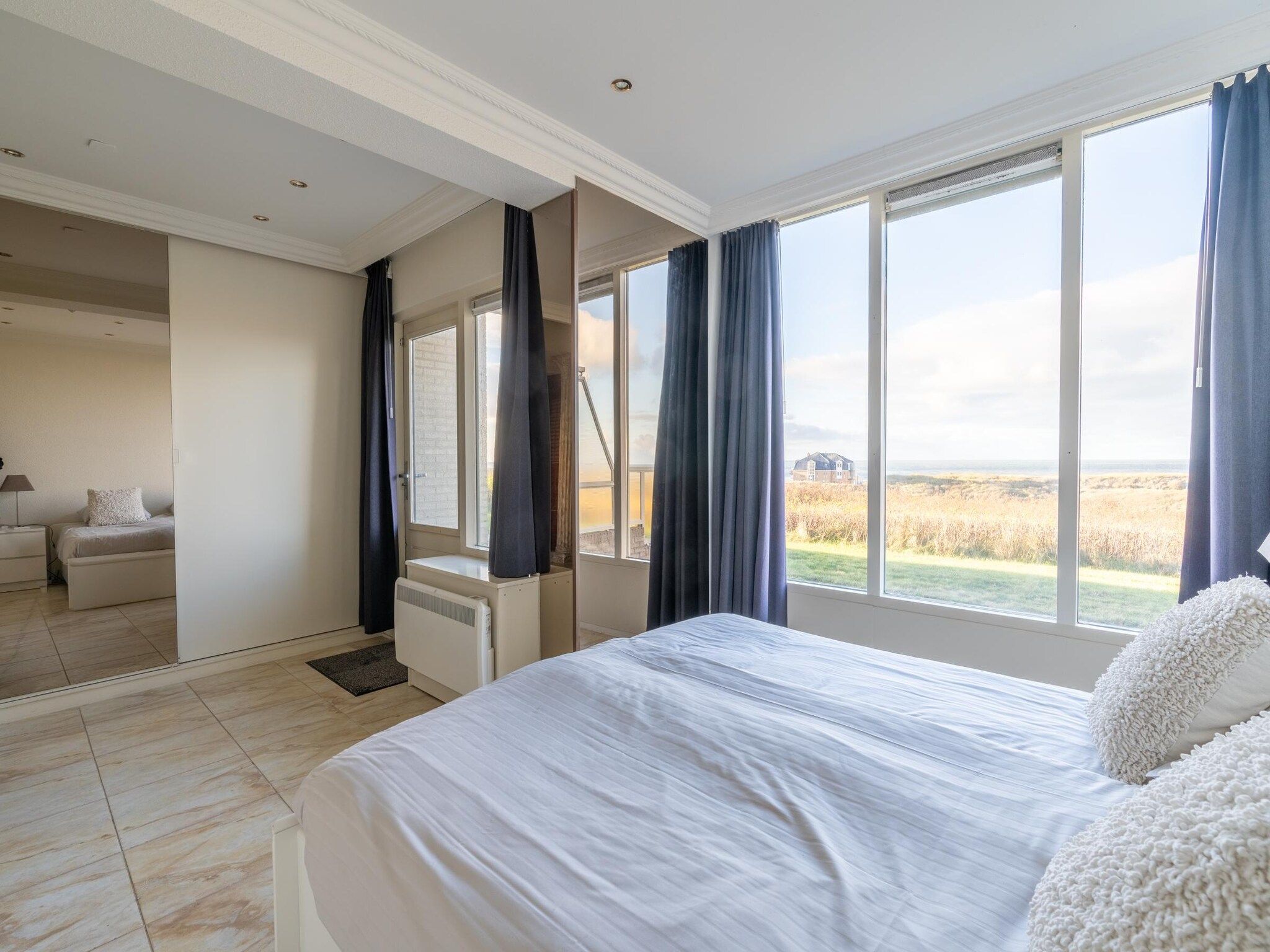 Een slaapkamer van Juliana 064 in De Koog